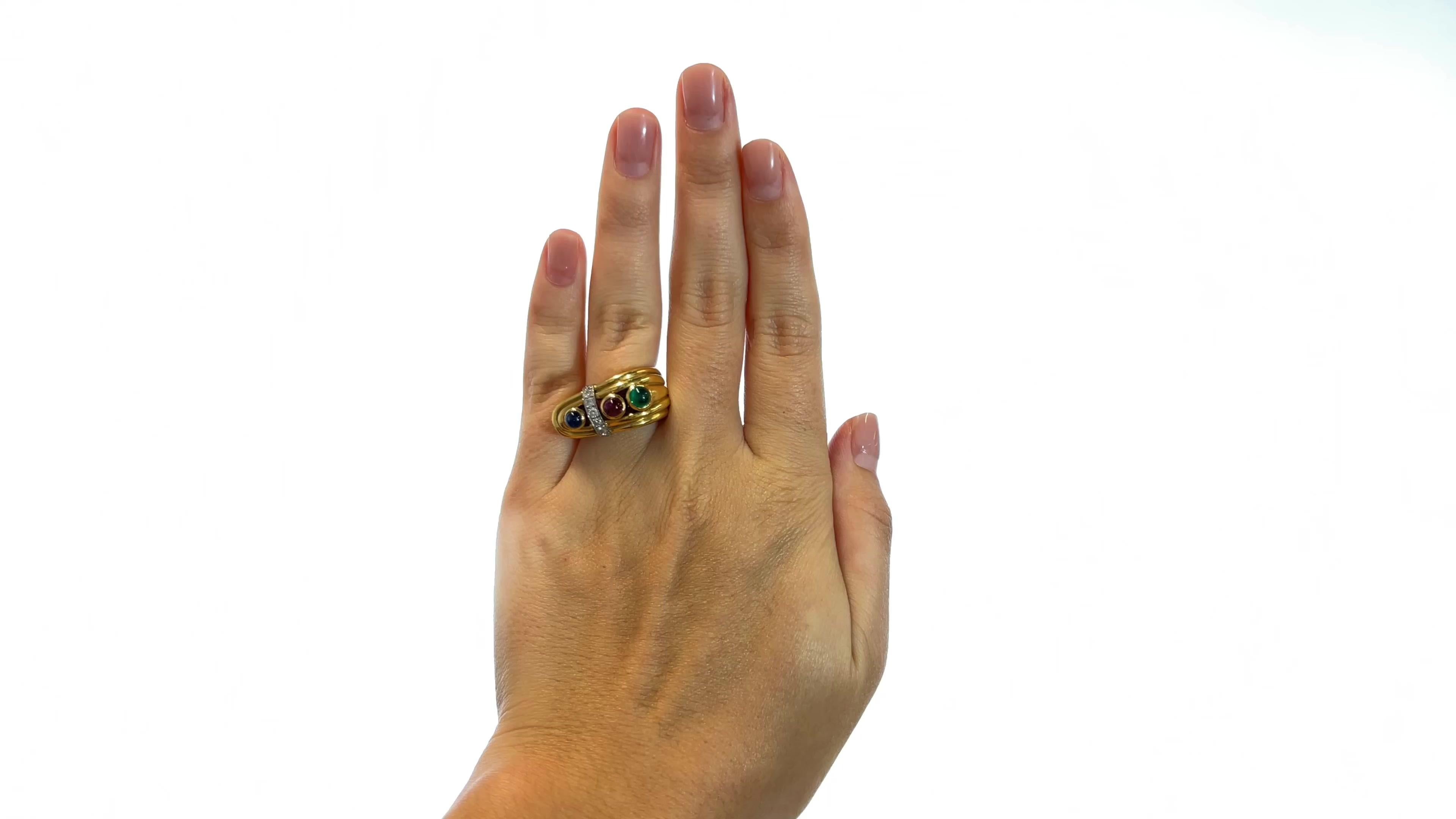 One Vintage David Webb Gemstone 18k Gold Ring. Featuring one cabochon sapphire weighing approximately 0.51 carat, one cabochon ruby weighing approximately 0.46 carat, and one cabochon emerald weighing 0.70 carat. Accented by seven round brilliant
