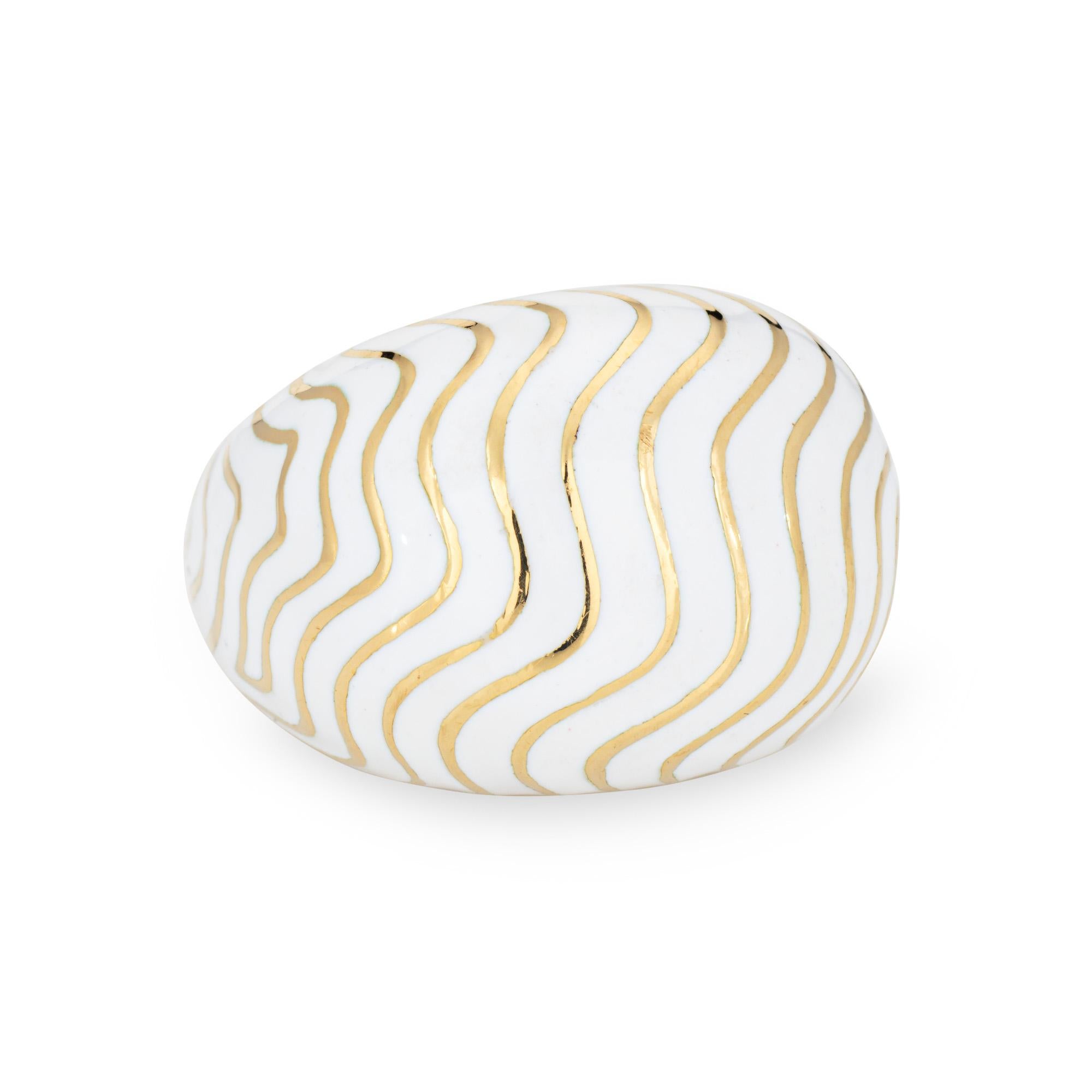 Vintage David Webb bombe dome ring crafted in 18 karat yellow gold (circa 1980s).  

White enamel and swirls of gold define the distinct David Webb design. The high dome ring (15mm - 0.59 inches) makes a wonderful chic statement on the hand.