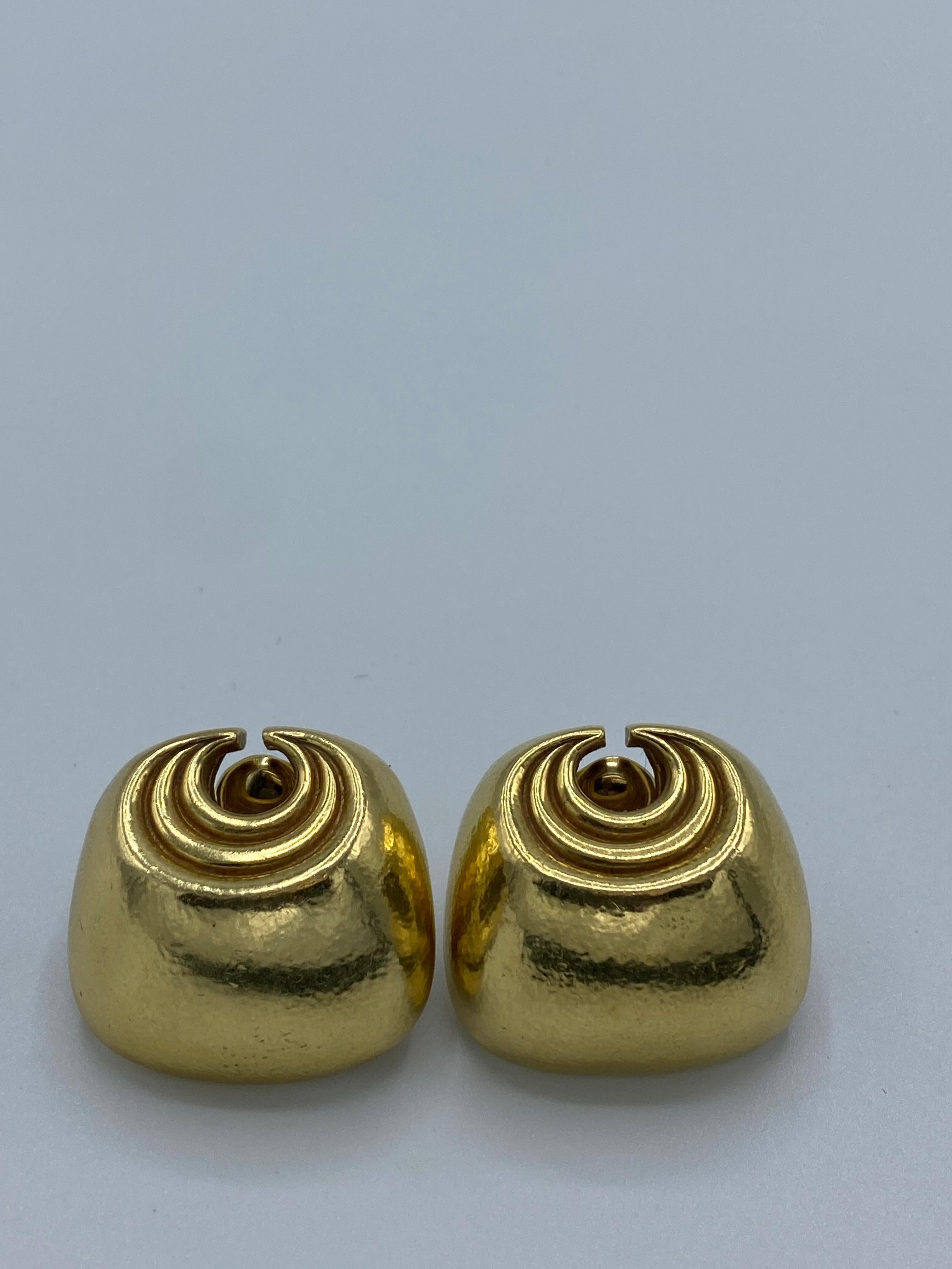 Product details:

The earrings are designed by David Webb in 1980's. It is made out of 18 karat yellow gold and it features hammered finish.
Total weight is 40.3 grams.
Measurements are 1.25 inch wide and 1.25 inch long.
It is signed WEBB and