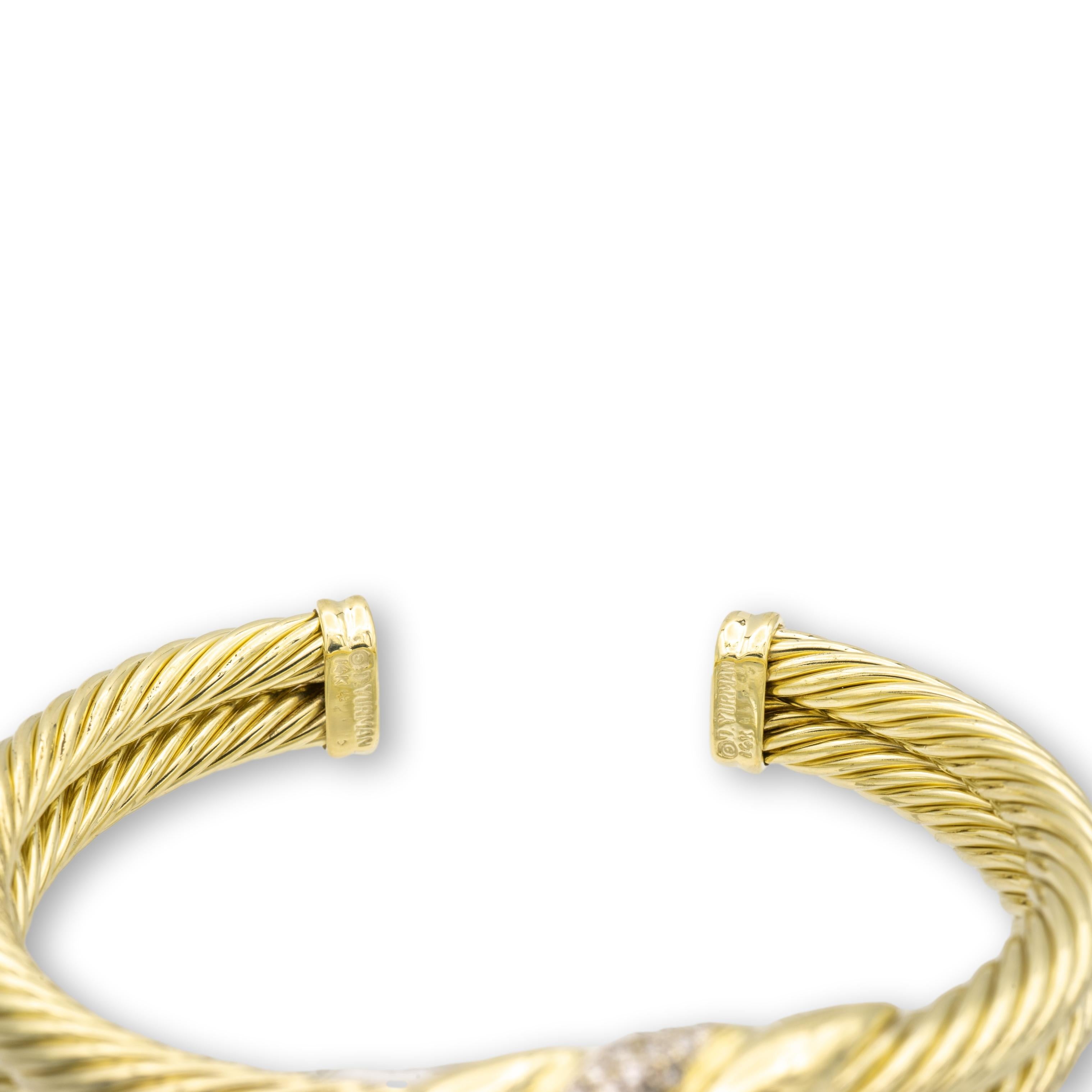 Vintage David Yurman open cuff bracelet from the Cable Classics collection finely crafted in 14 karat yellow gold with two rows of twisted cable adorned with a triple wave embellishment center featuring pave set round brilliant cut diamonds weighing