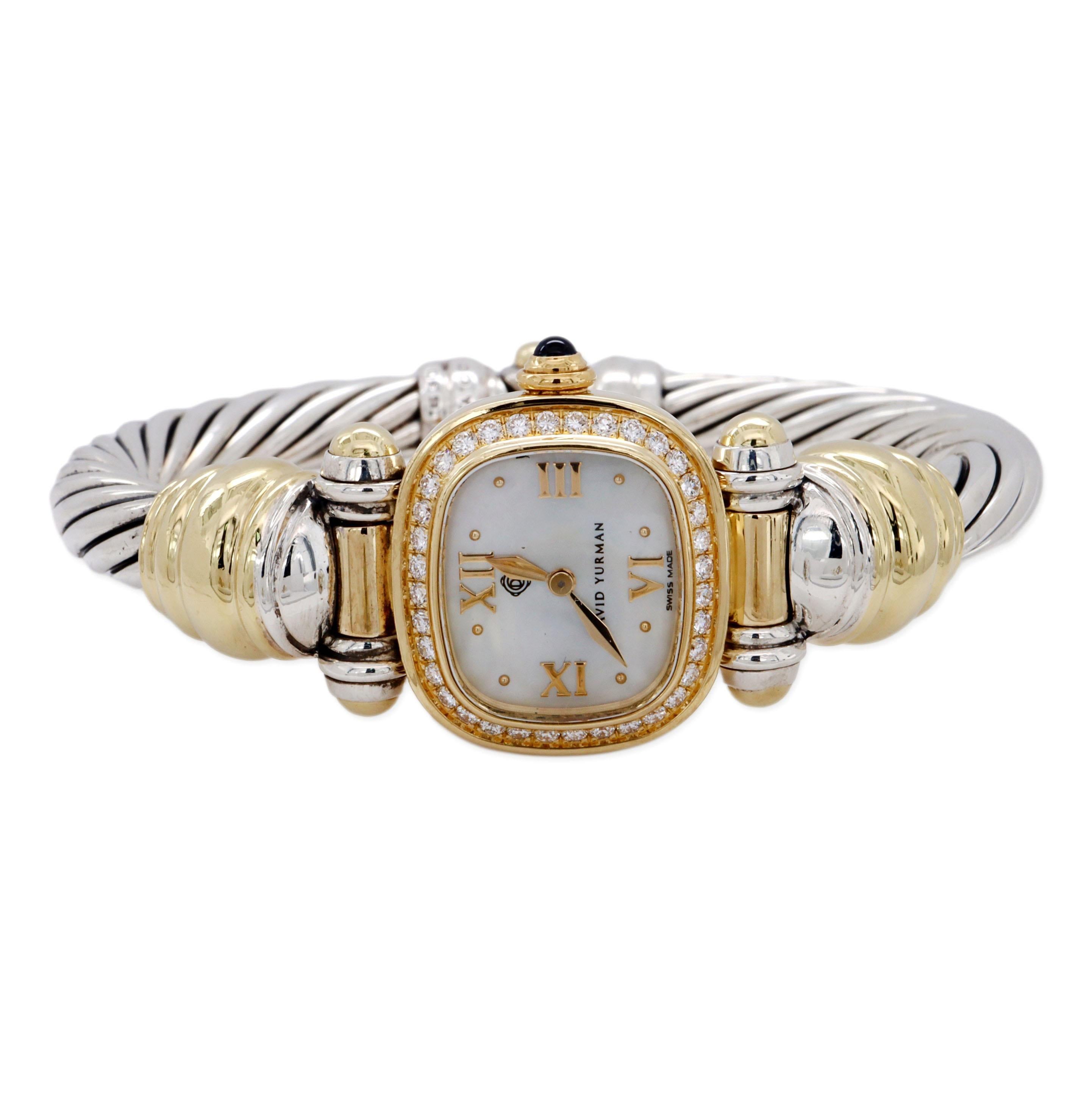 Vintage David Yurman ladies wrist watch finely crafted in 18 karat yellow gold and sterling silver featuring a 21mm diamond bezel watch face with a cabochon sapphire crown, sapphire crystal, mother of pearl dial and gold roman numeral markers. The