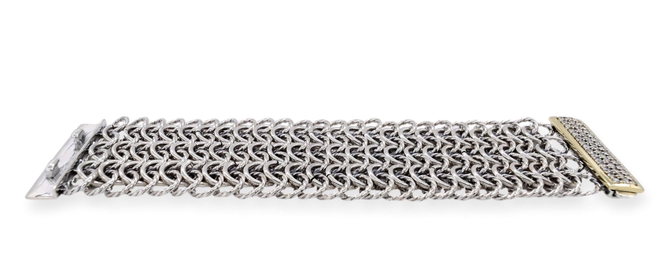 Vintage David Yurman bracelet finely crafted in sterling silver featuring a diamond clasp with round brilliants weighing 2 carats total weight approximately set in prongs inside an 18K yellow gold bezel frame. Bracelet has five rows of interlocking