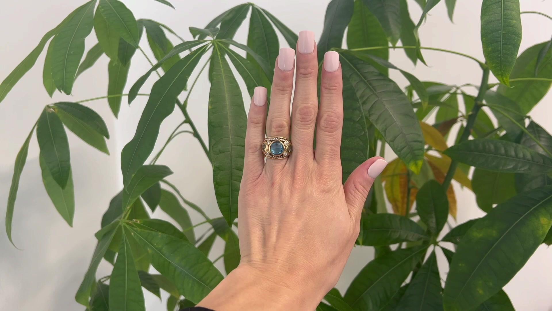 One Vintage David Yurman Blue Topaz Prasiolite Diamond 18K Gold Silver Renaissance Ring. Featuring one round faceted swiss blue topaz weighing approximately 5.50 carats. Accented by two round faceted prasiolite with a total weight of approximately