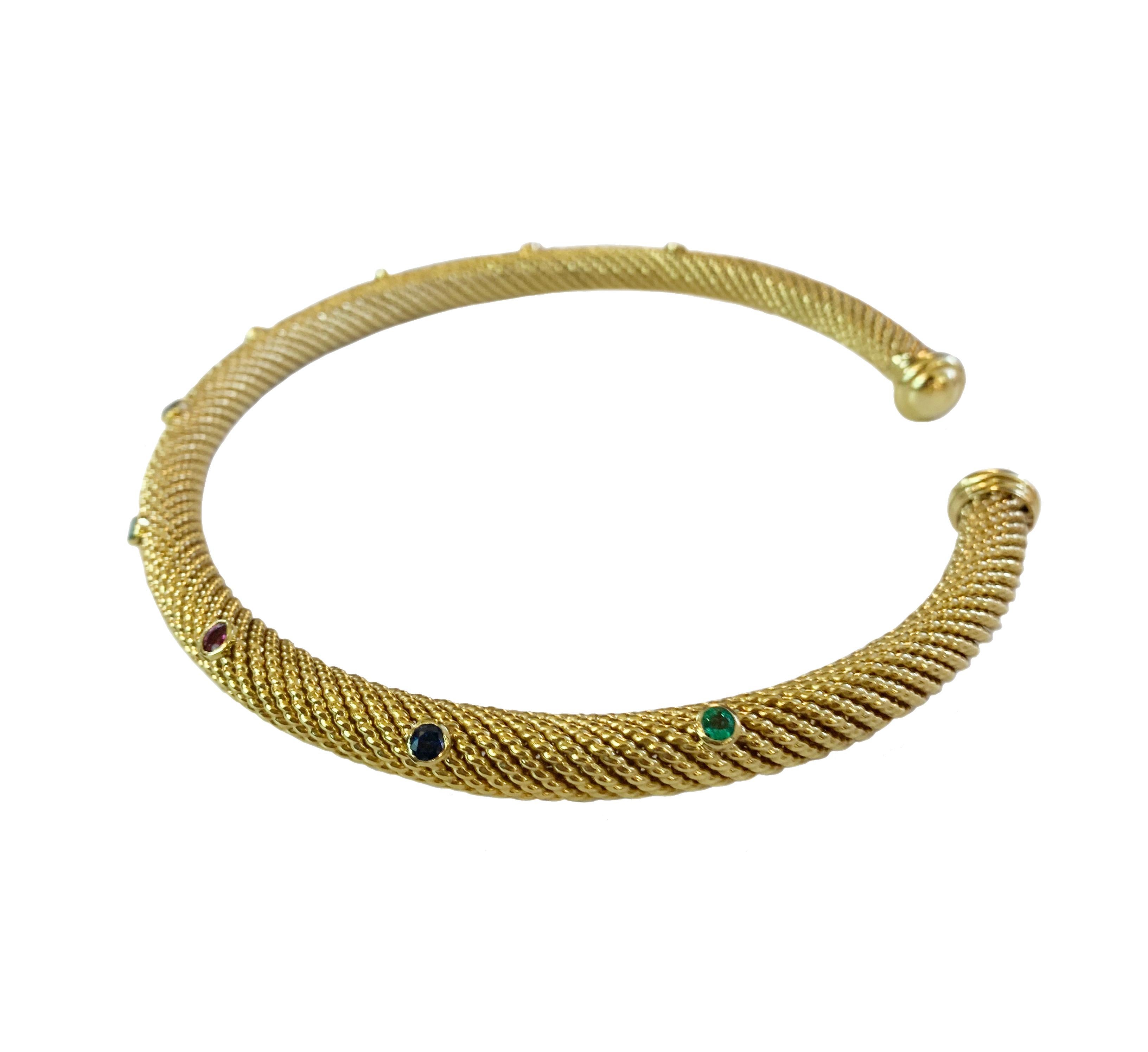 -Mint condition

-18k Yellow Gold

-Weight: 71.7gr

-Width: 9mm

-Stones: Emerald, Sapphire, Ruby

-Inner circumference: 15”

-Comes with Box

-Retail: $15000