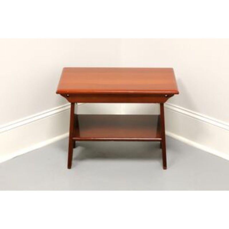 A small Country style bench by Davis Cabinet Co. of Nashville, Tennessee, USA. Solid cherry with apron, 