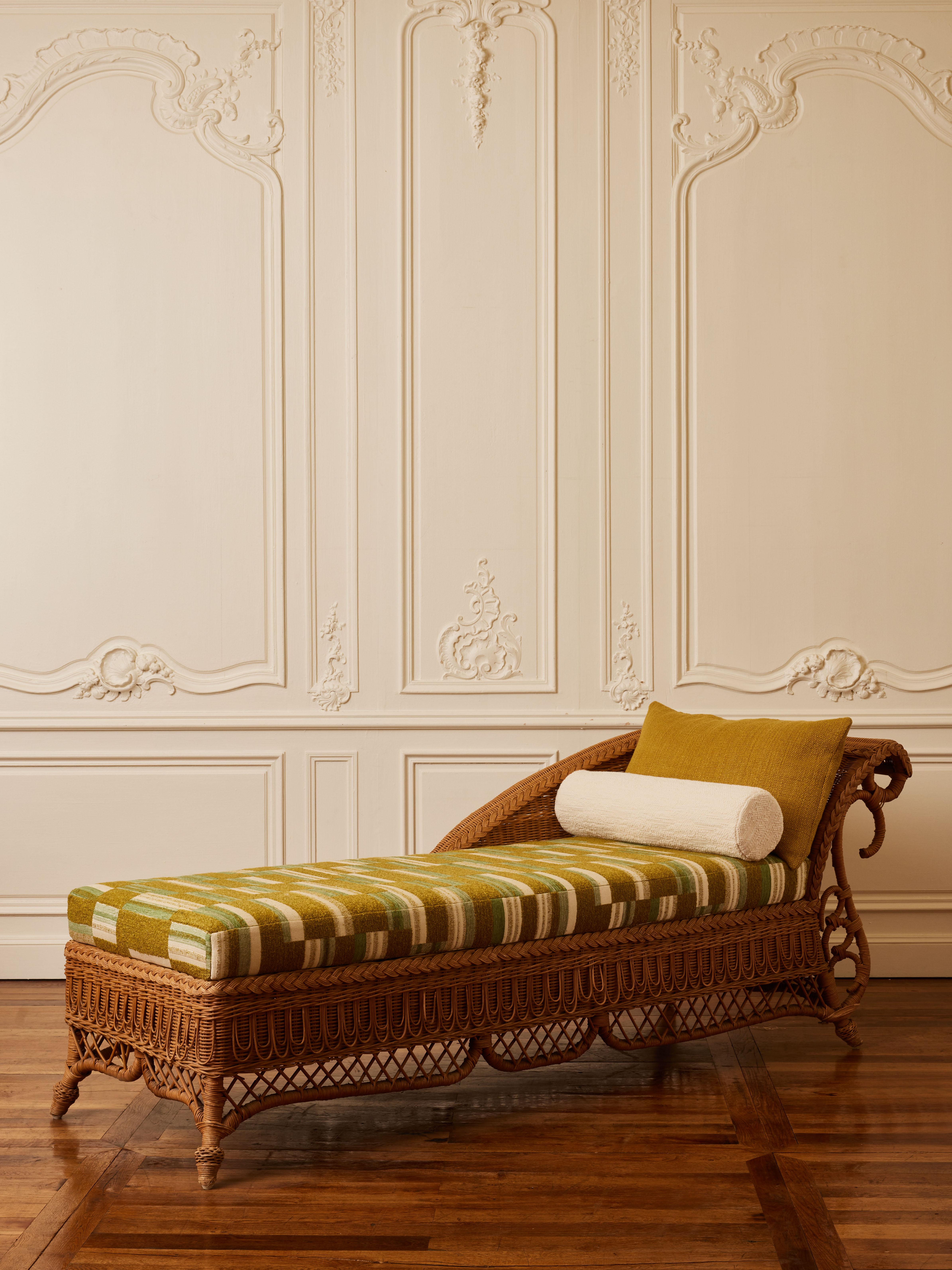 Vintage day bed in rattan with cushions reupholstered with fabrics by Elitis.
Italy, 1970s.