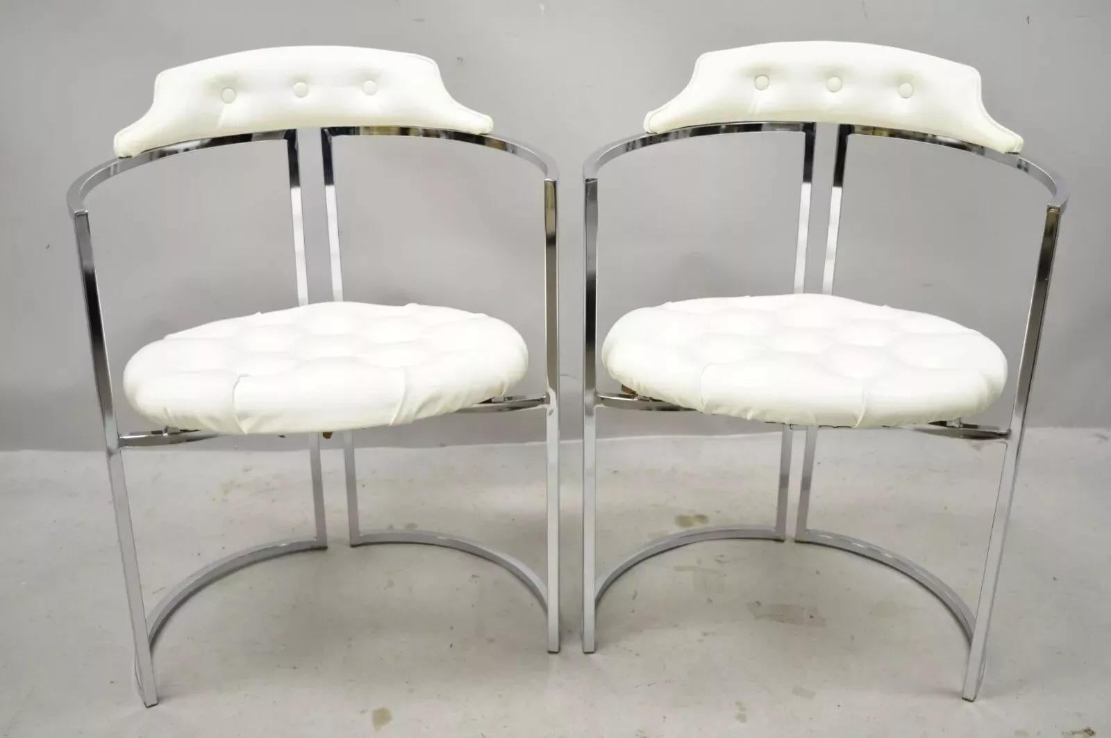 Vintage Daystrom Mid Century Modern Chrome White Vinyl Dining Chairs - Set of 4. Item features chrome frames, white vinyl upholstery, original label, very nice vintage item, sleek sculptural form. Circa Mid 20th Century. Measurements: 31.5