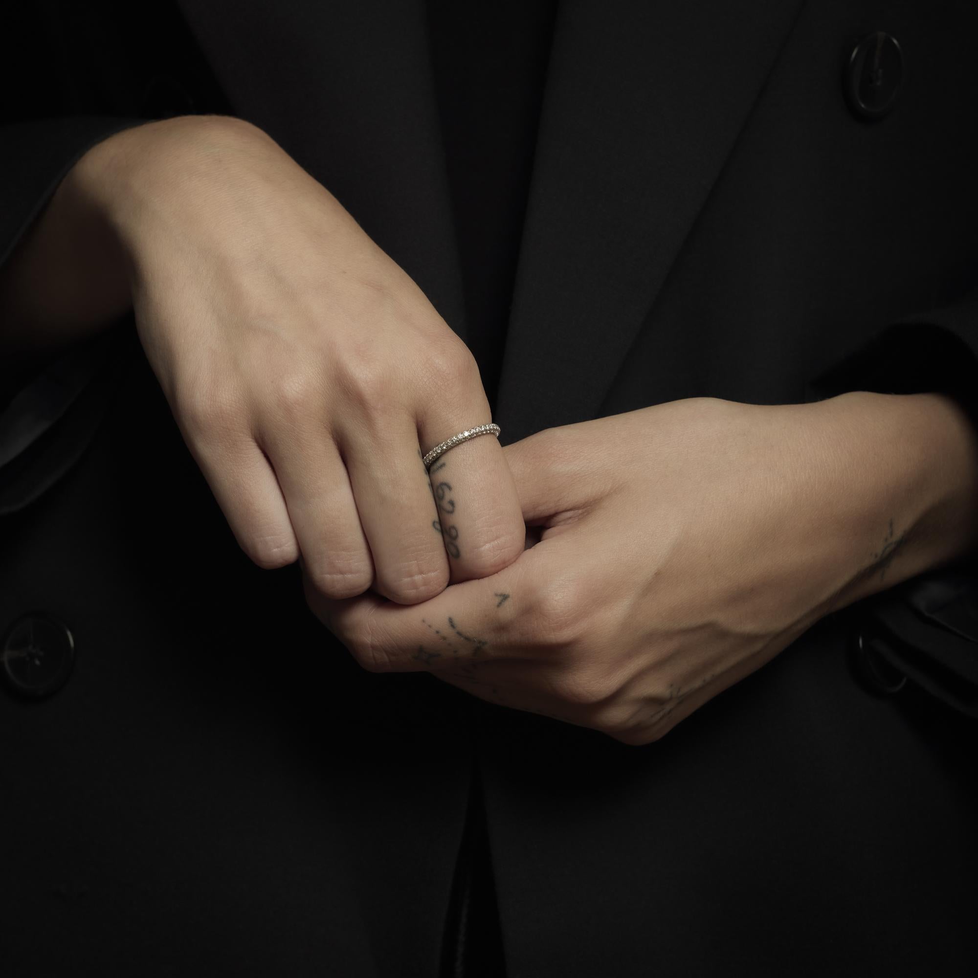 This vintage De Beers ring from the 1990’s shimmers with 120 round brilliant cut diamonds, totaling approximately 1.20 carats in fine E-F color and VS clarity. The diamonds are set in gleaming 18k white gold, creating a luminous, continuous sparkle