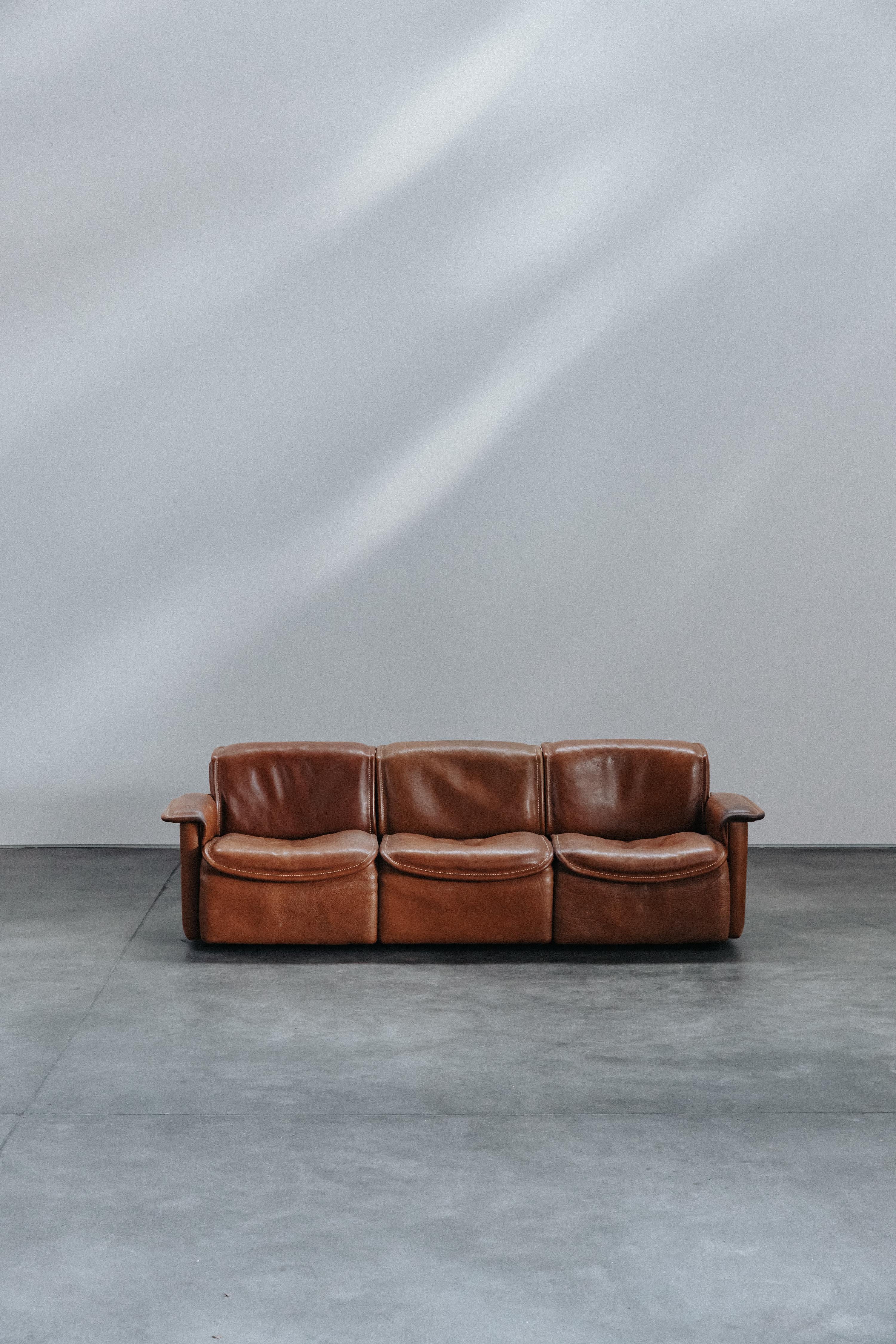 Vintage De Sede DS-12 Sofa From Switzerland, Circa 1970.    Original cognac leather upholstery with fantastic patina and wear.