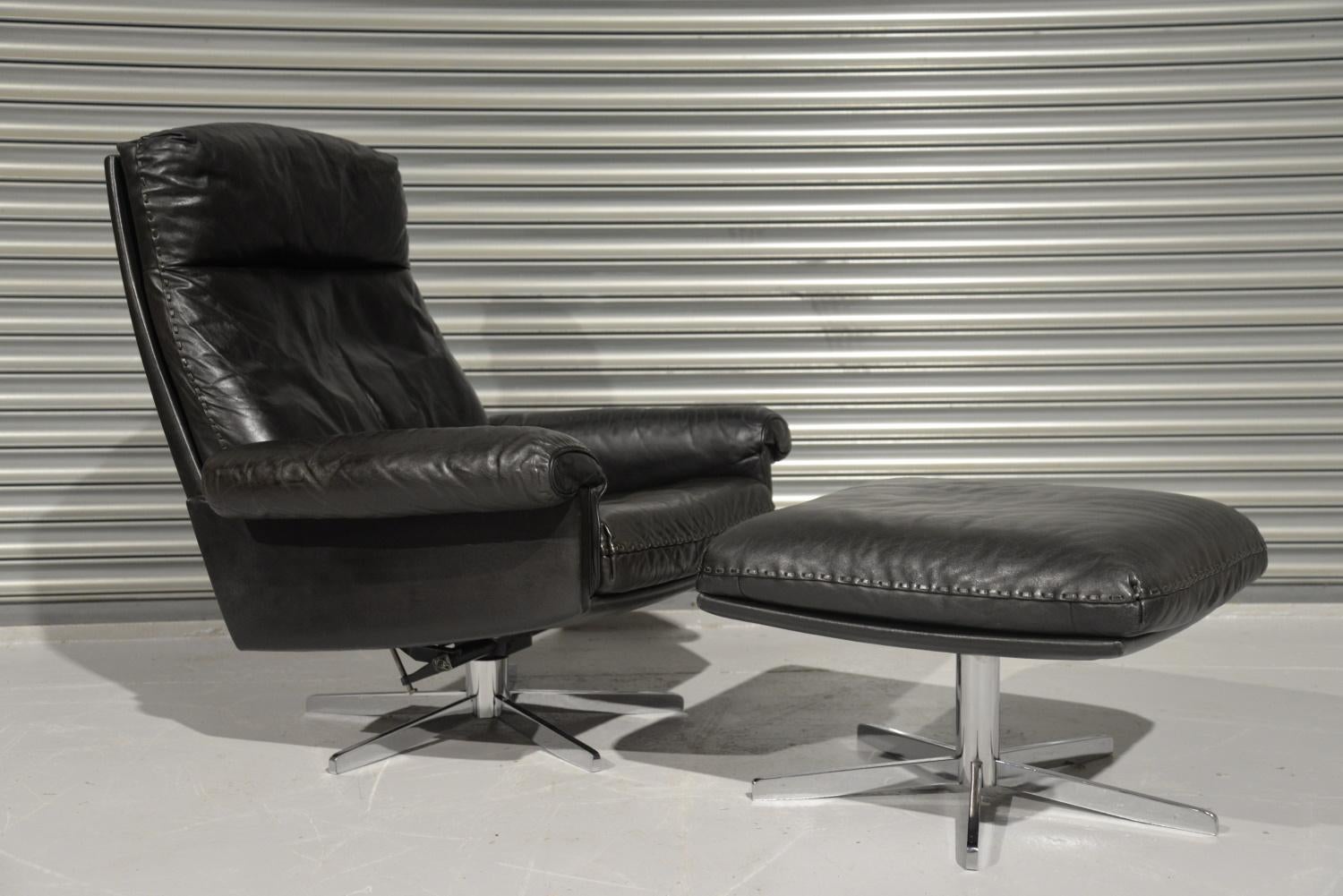 Discounted airfreight for our US and International customers (from 2 weeks door to door)

We are delighted to bring to you a highly desirable and rarely available vintage 1970s De Sede DS 31 high back swivel recling leather armchair with ottoman.