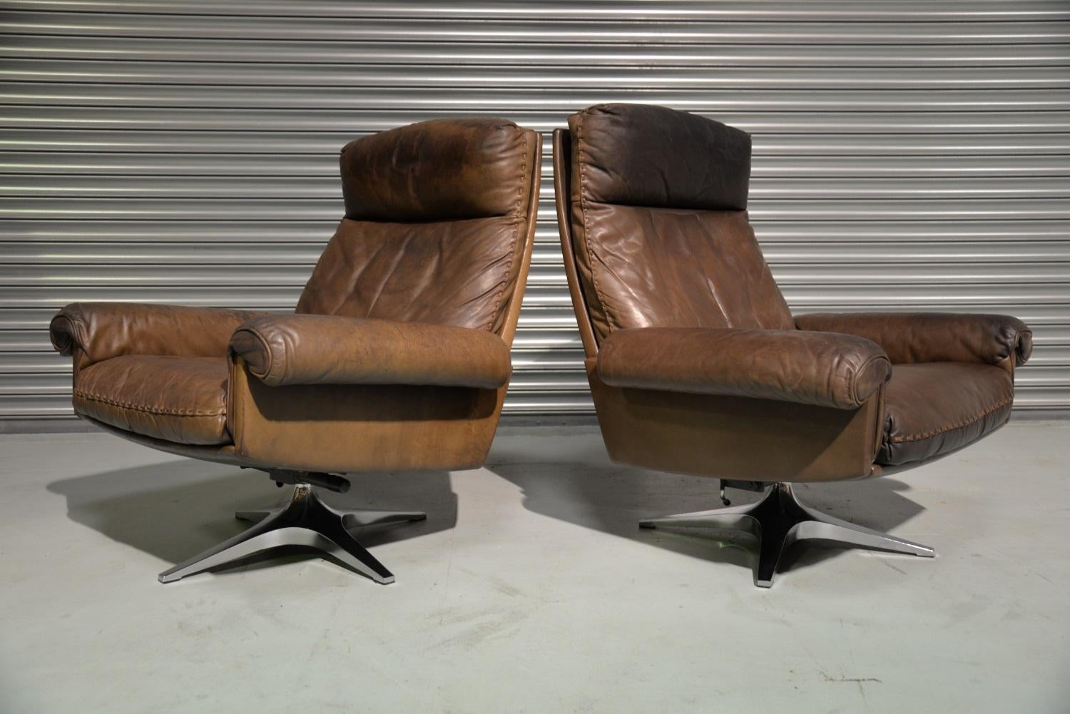 Discounted shipping rates for our US Continent and International customers ( from 2 weeks door to door)

We are delighted to bring to you a pair of vintage de Sede DS 31 high back swivel lounge armchairs. Hand built in the early 1970s by De Sede