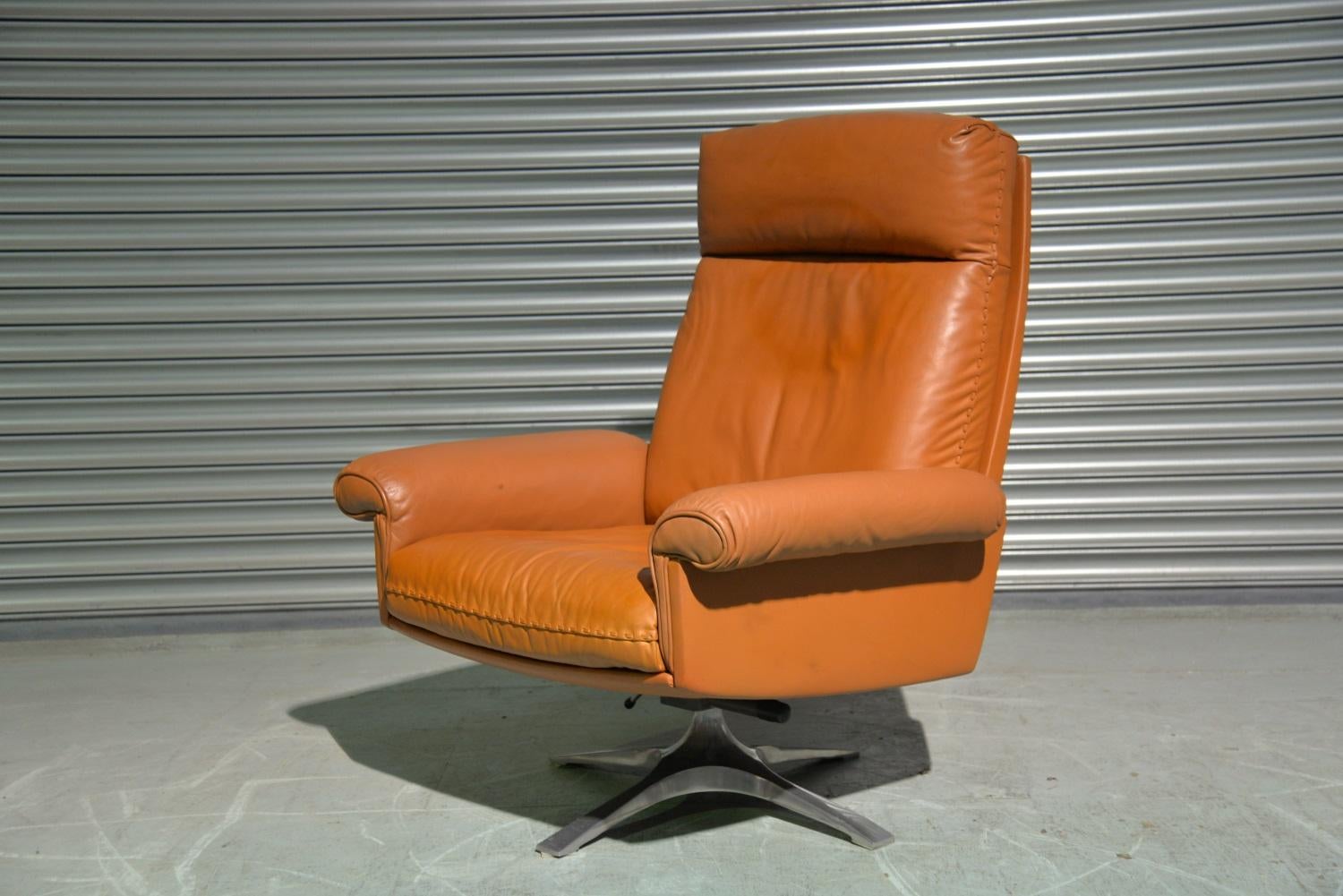 Discounted airfreight for our US and International customers (from 2 weeks door to door)

We are delighted to bring to you a vintage 1970s De Sede DS 31 swivel high-back armchair. The armchair was hand built circa 1970s by De Sede craftsman from