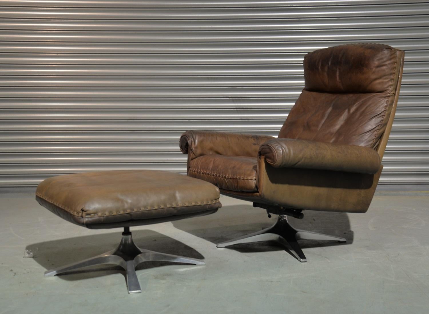Discounted airfreight for our US and International customers ( from 2 weeks door to door) 

We are delighted to bring to you a highly desirable and rarely available vintage 1970s De Sede DS 31 high back swivel lounge armchair with ottoman. Hand