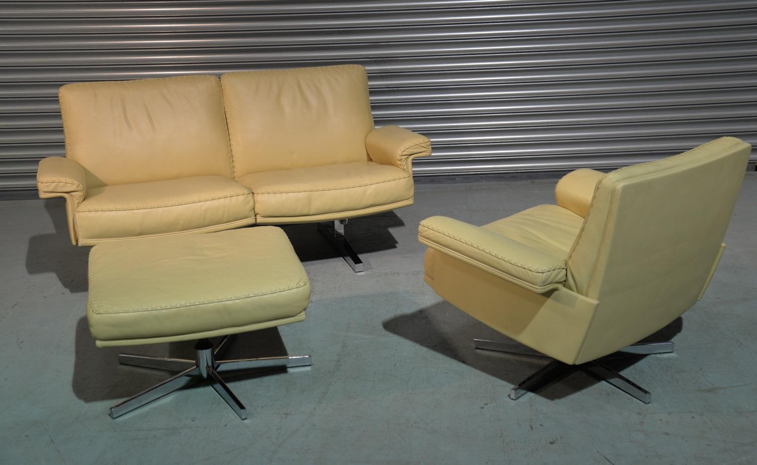 We are delighted to bring to you an extremely rare vintage De Sede DS 35 two-seat sofa and matching swivel lounge armchair and ottoman in beautiful soft cream leather with superb whipstitch edge detail. Hand built in the 1970s by de Sede craftsman