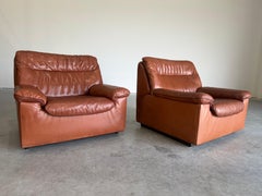 Par de sillones vintage De Sede DS-66 de cuero marrón, Suiza, alrededor de los años 70