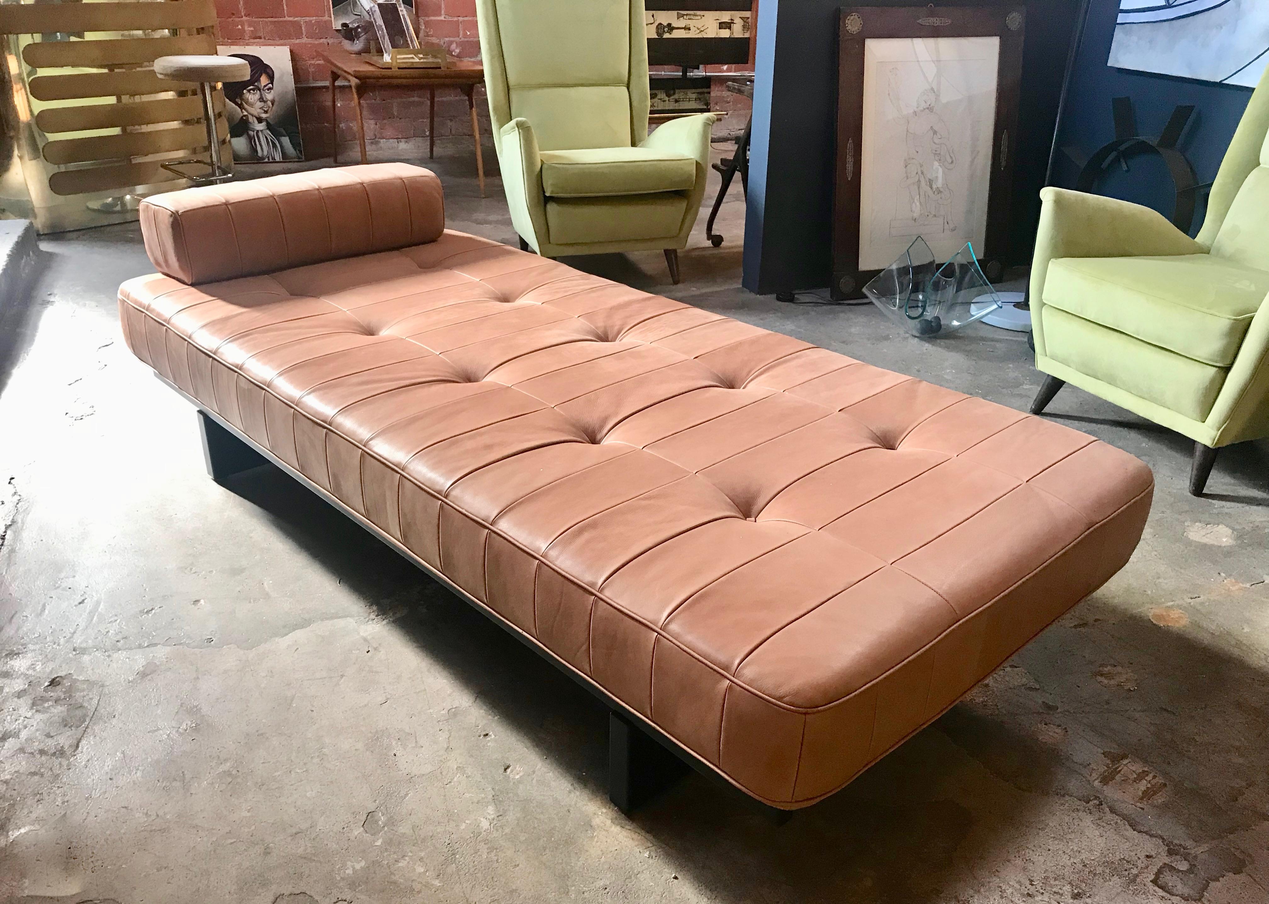 Rare original De Sede DS 80 daybed with one bolster patchwork cushion. Hand built in the 1960s to incredibly high standards by De Sede craftsman in Switzerland. The daybed stands on a black wooden frame and is extremely comfortable, upholstered in