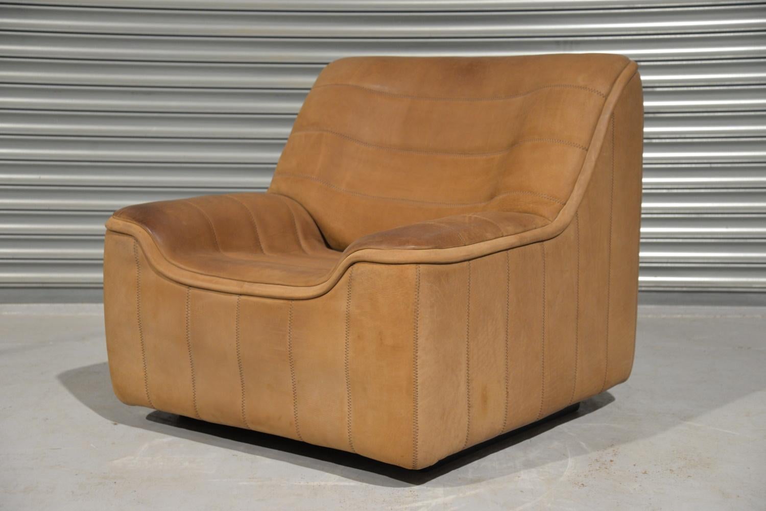 We are delighted to bring to you an ultra-rare vintage De Sede DS 84 armchair. Hand built in the 1970s by De Sede craftsman in Switzerland, this piece is upholstered in thick light brown neck leather with superb hand stitch detail. This piece is are