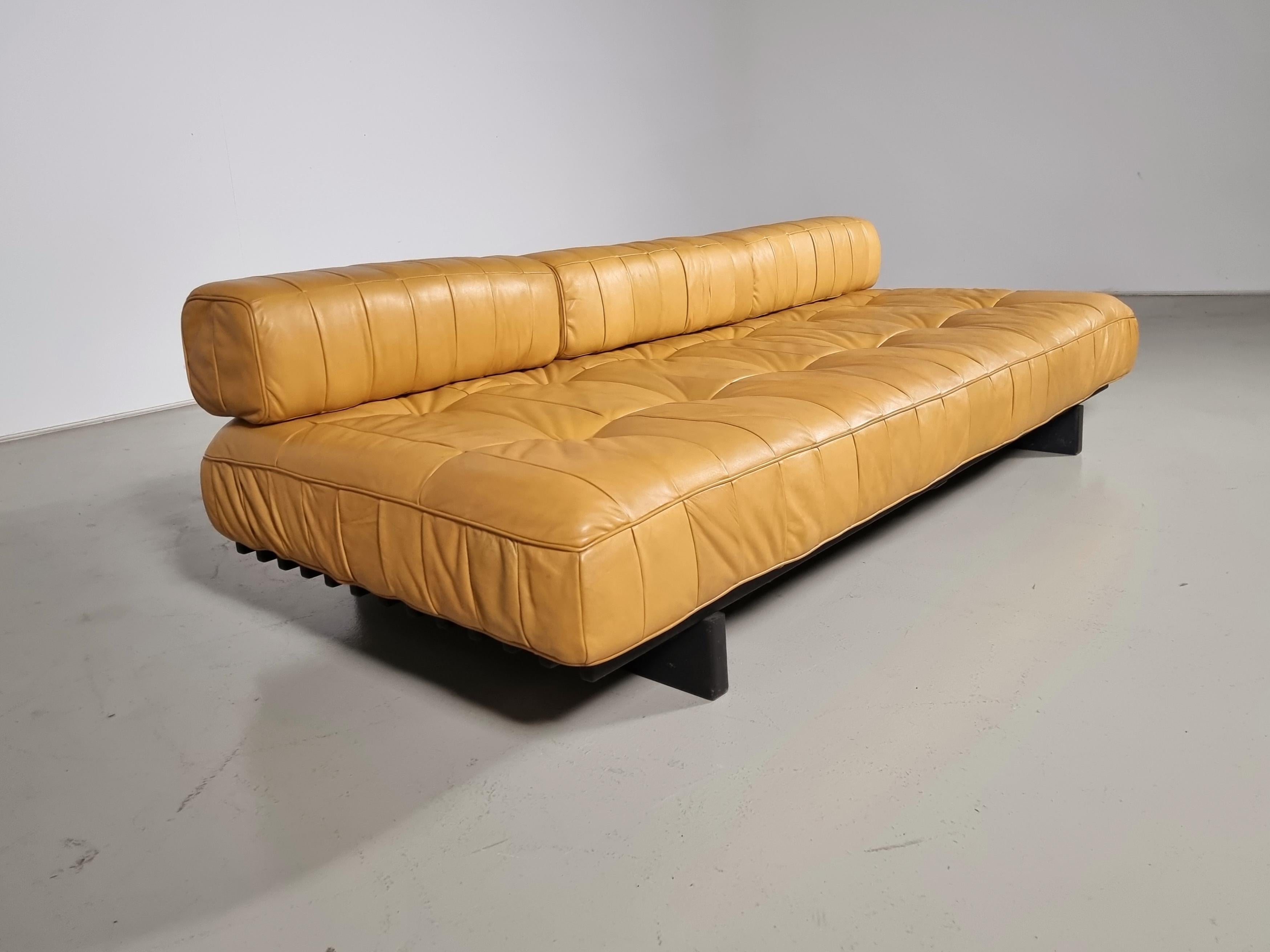 De Sede DS80 light cognac leather patchwork daybed, Switzerland, 1970. Upholstered in its beautiful and soft original aniline leather. 

The DS-80 sofa unites all of the characteristics of De Sede‘s furniture. Excellent manufacturing quality,