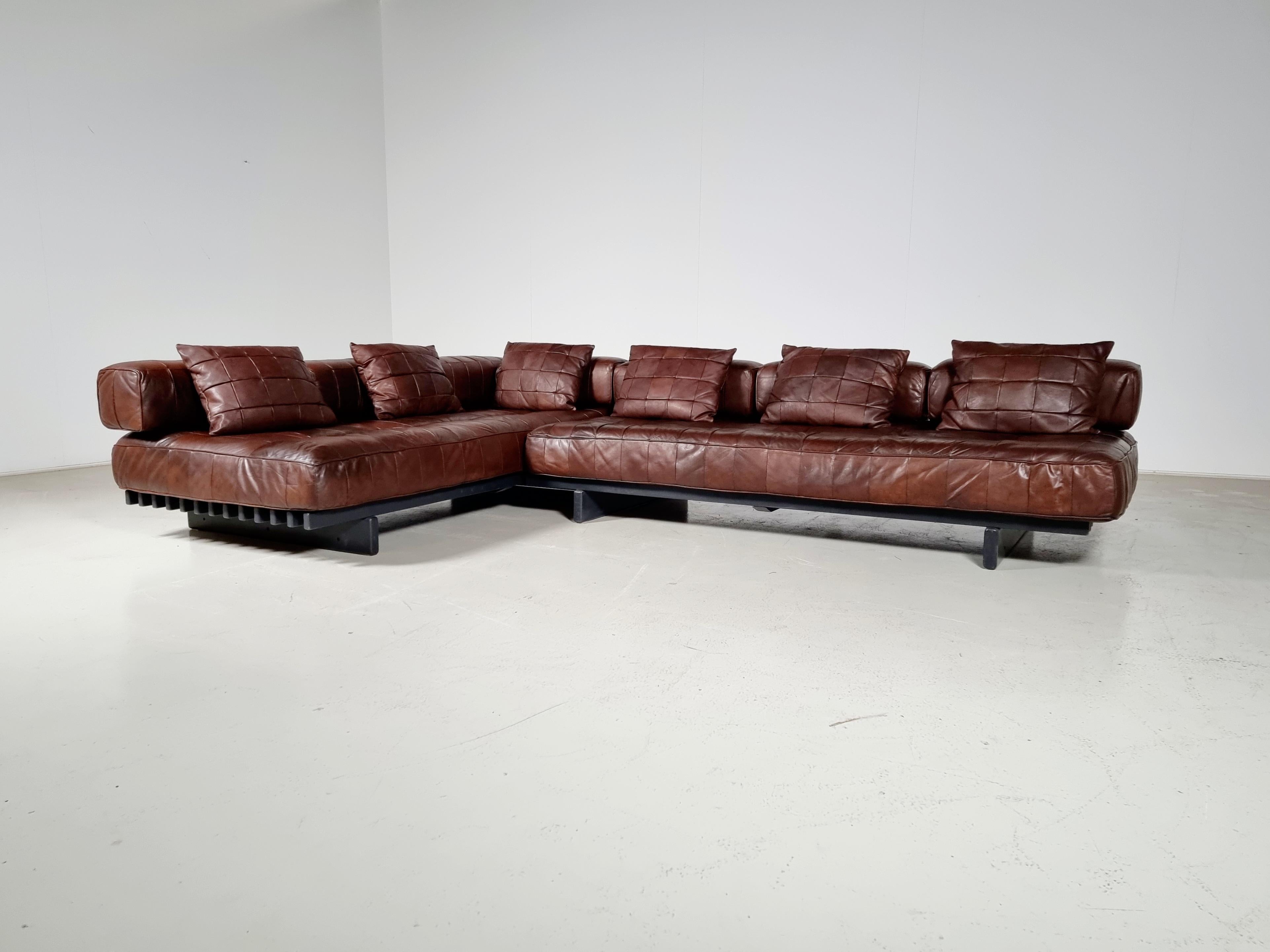 Rare set of 2 Brown leather patchwork De Sede DS80 daybeds with backrests and armrest, Switserland, 1970. Originally upholstered in beautiful and soft aniline leather. The patchwork design of the daybed results in a slightly non-regular pattern of