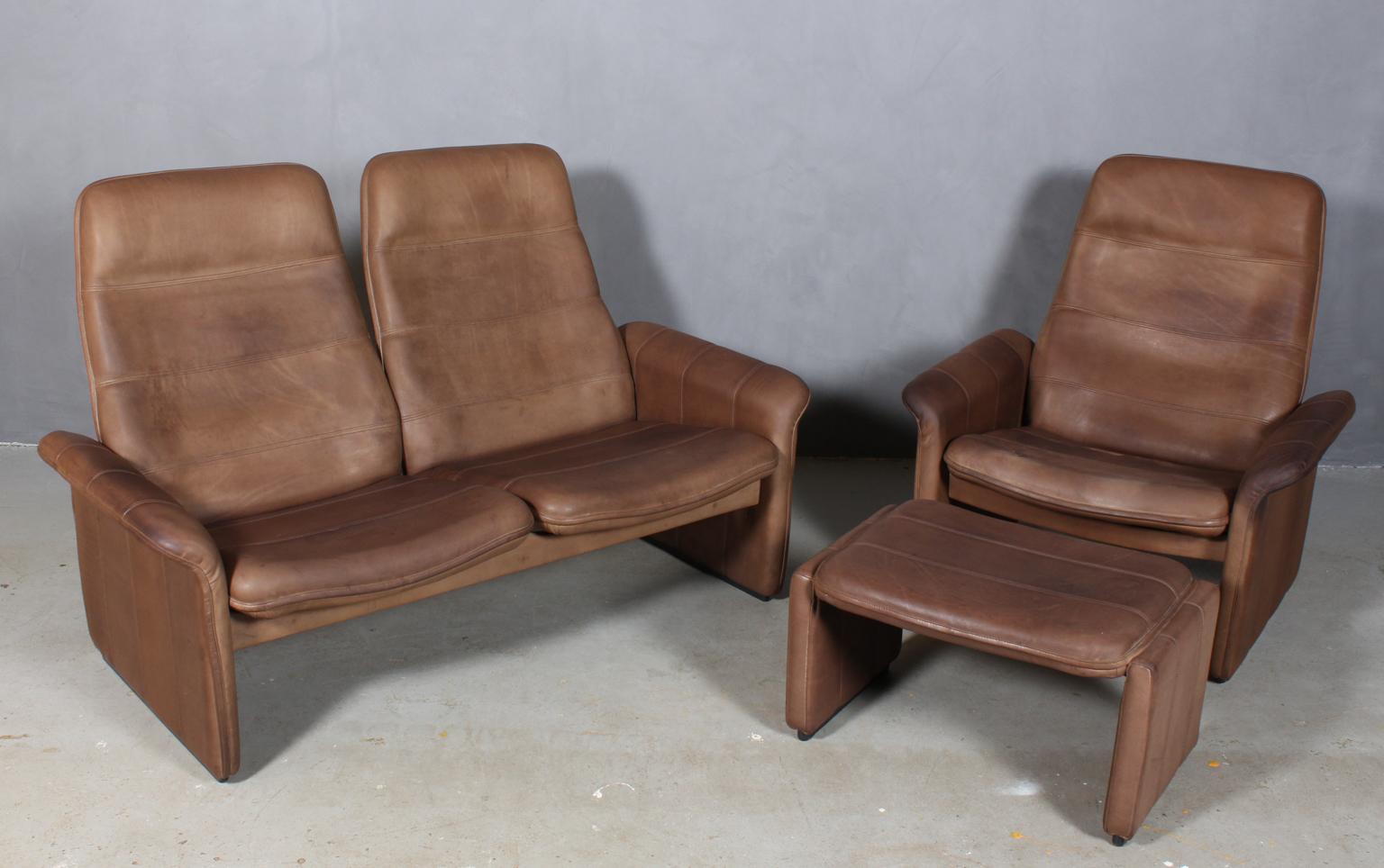 Vintage De Sede Exclusive, sofa set with two-seat sofa and lounge chair with ottoman. Lounge chair with adjustable back.
 
The high quality leather is in very good condition and with wonderful patina.

De Sede once started as a saddler's