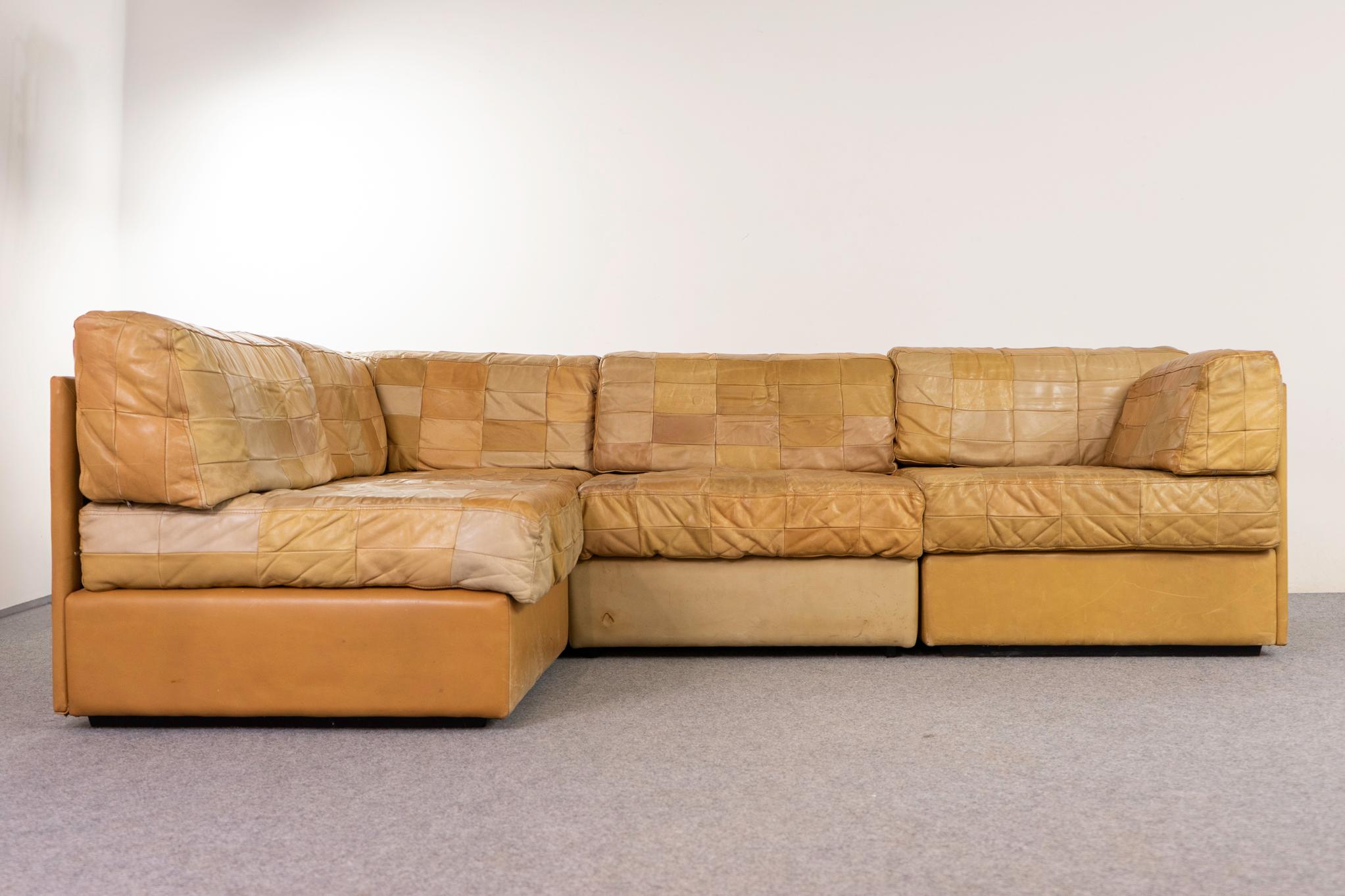 Leather mid-century sectional by De Sede, circa 1970's. Rare sectional consisting of: 2 regular, 1 end and a corner section.  A quadrant partnered, highly patinated patchwork of original buffalo leather. Sink in and tune out!