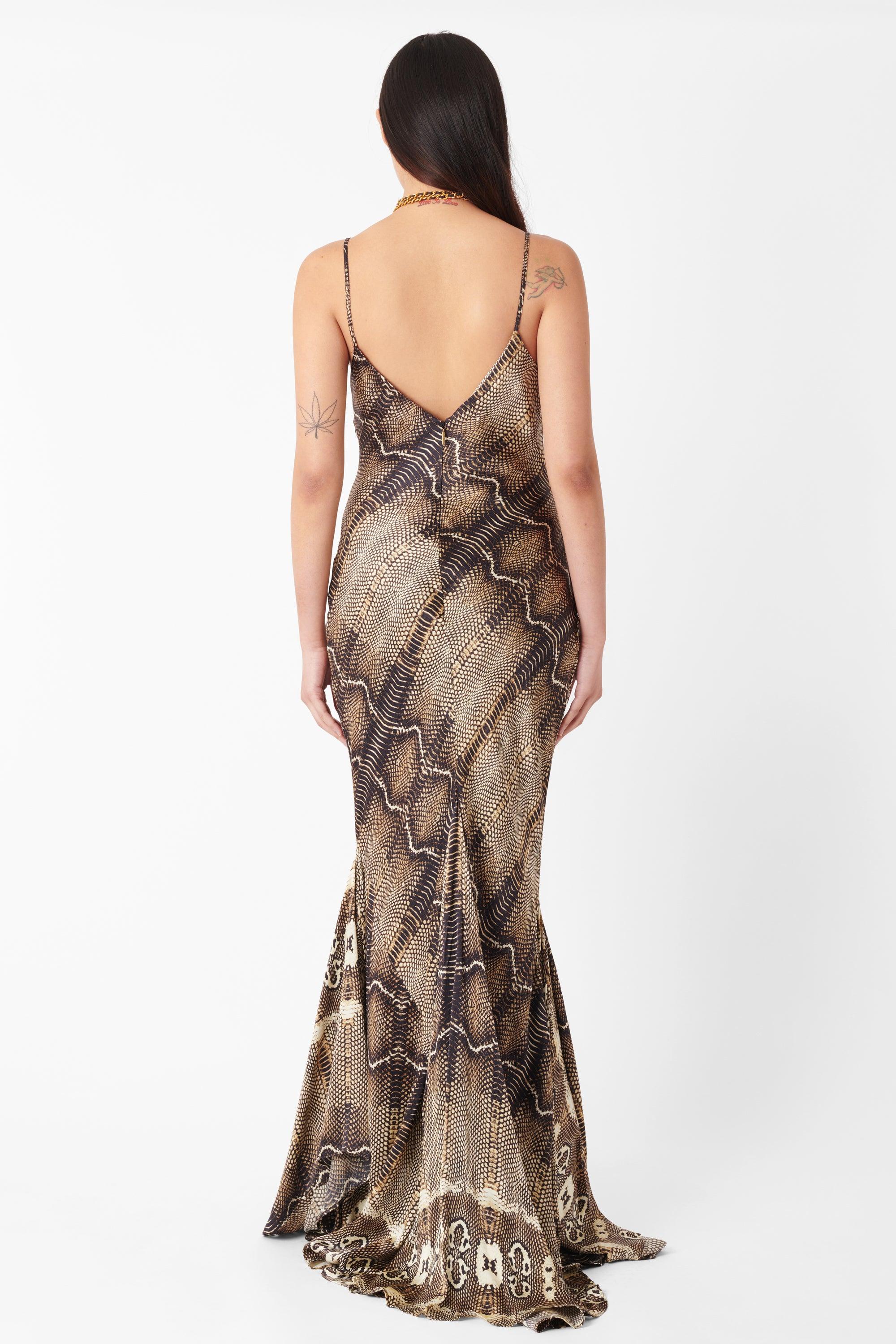 Vintage Deadstock Roberto Cavalli 2005 Silk Python Print Dress. Dress features a bias cut and handkerchief hem with an all over python print, thin spaghetti straps in the same fabric  and an invisible zip in the back. In a maxi length. In excellent