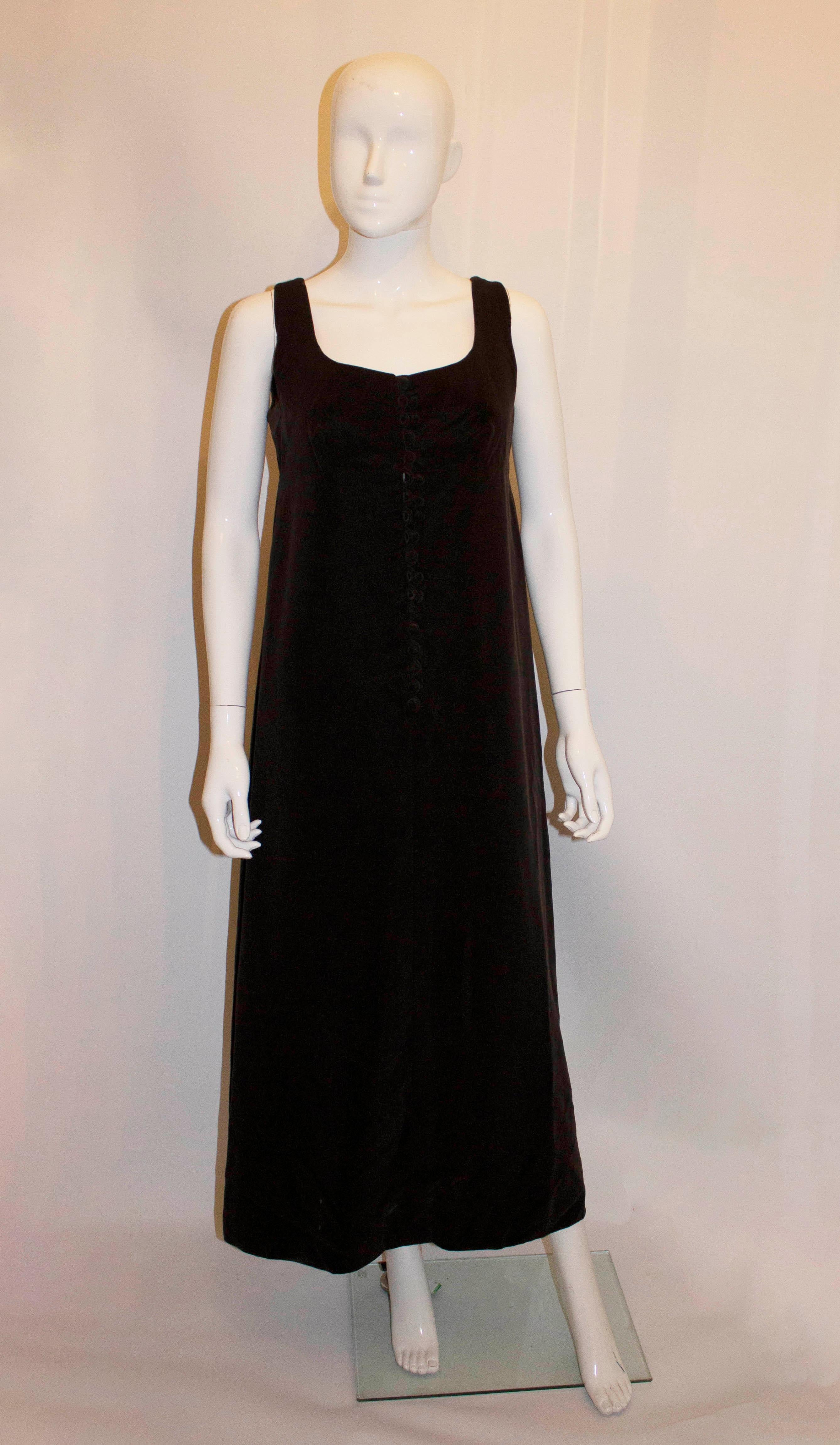 A vintage velvet pinafore by Deborah Newall for Harrods.  In a brown velvet, the dress has a scoop neckline , button down front, 3'' hem and is fully lined.