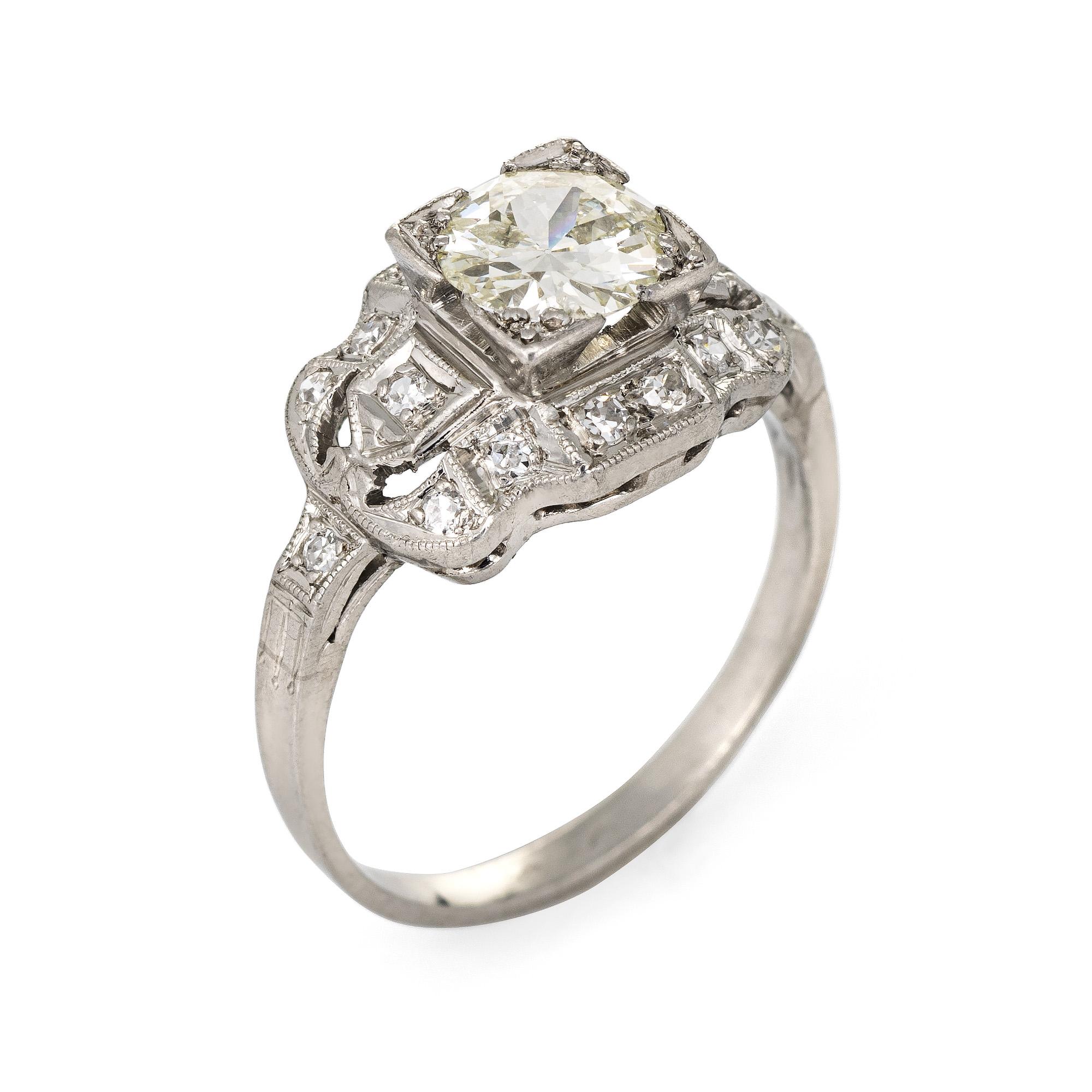 Finely detailed vintage Art Deco era diamond engagement ring (circa 1920s to 1930s) crafted 900 platinum. 

Centrally mounted estimated 0.85 carat old European cut diamond is estimated at I-J color and SI2 clarity. The side shoulders are set with an