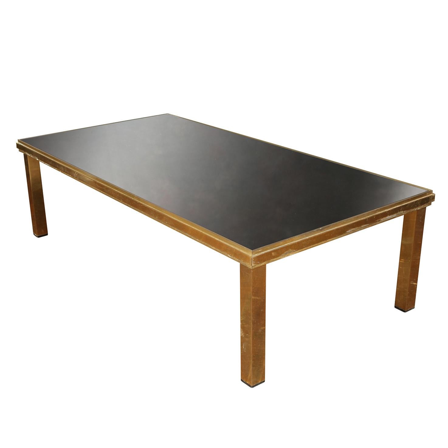 Vintage brass Art Deco coffee table with black glass top with etched, square design.