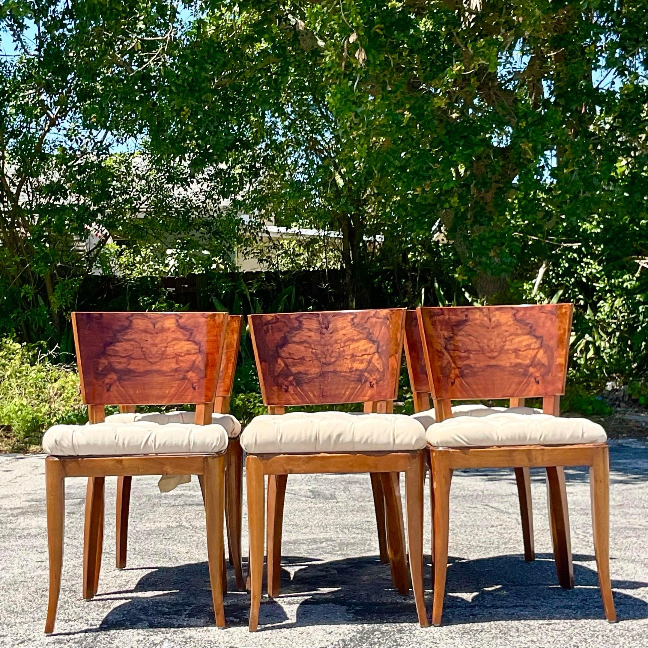 A stunning set of six vintage Deco dining chairs. Gorgeous Burl wood backs with incredible wood grain detail. Chic tufted flax seats in great condition. Acquired from a Palm Beach estate.