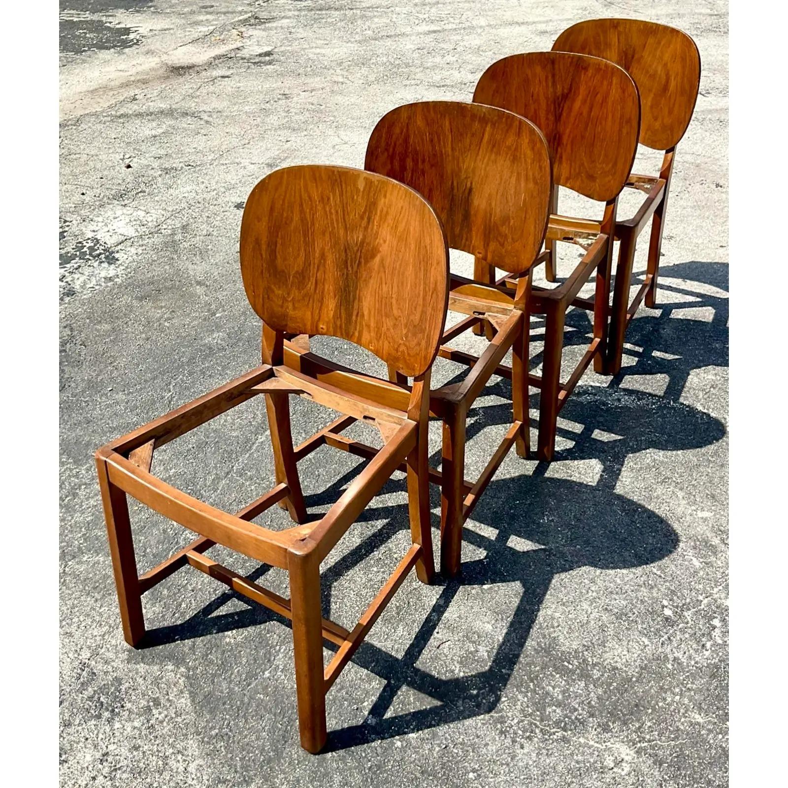 Fantastic set of four vintage Deco dining chairs. Beautiful paddle back design with gorgeous wood grain detail. Ready for you to get fresh seats and make them your own. Acquired from a Palm Beach estate.