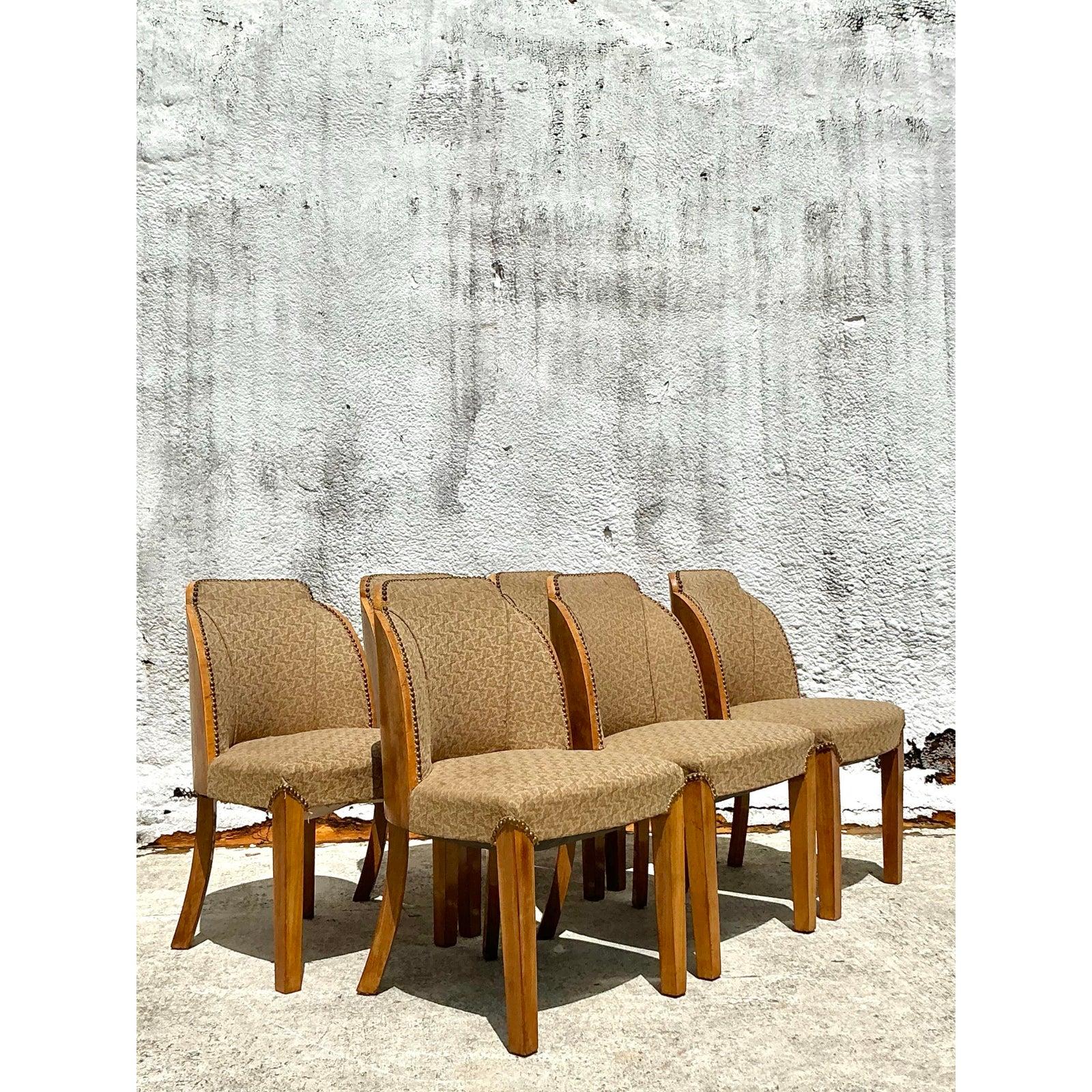 Step into an era of unparalleled glamour with this magnificent set of six Vintage Art Deco Dining Chairs, beautifully reminiscent of the iconic designs by Harry and Lou Epstein. Each chair boasts a distinctive curved back, likely crafted with