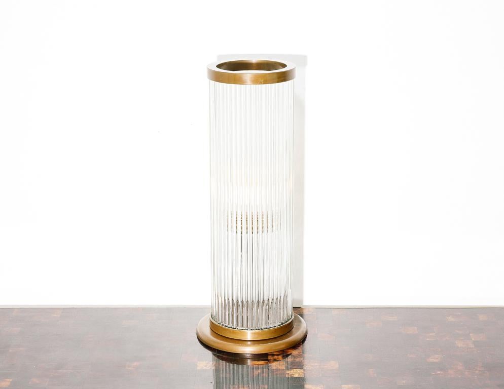 Vintage table lamp in the Art Deco style. Fluted glass shade with brass base accents.