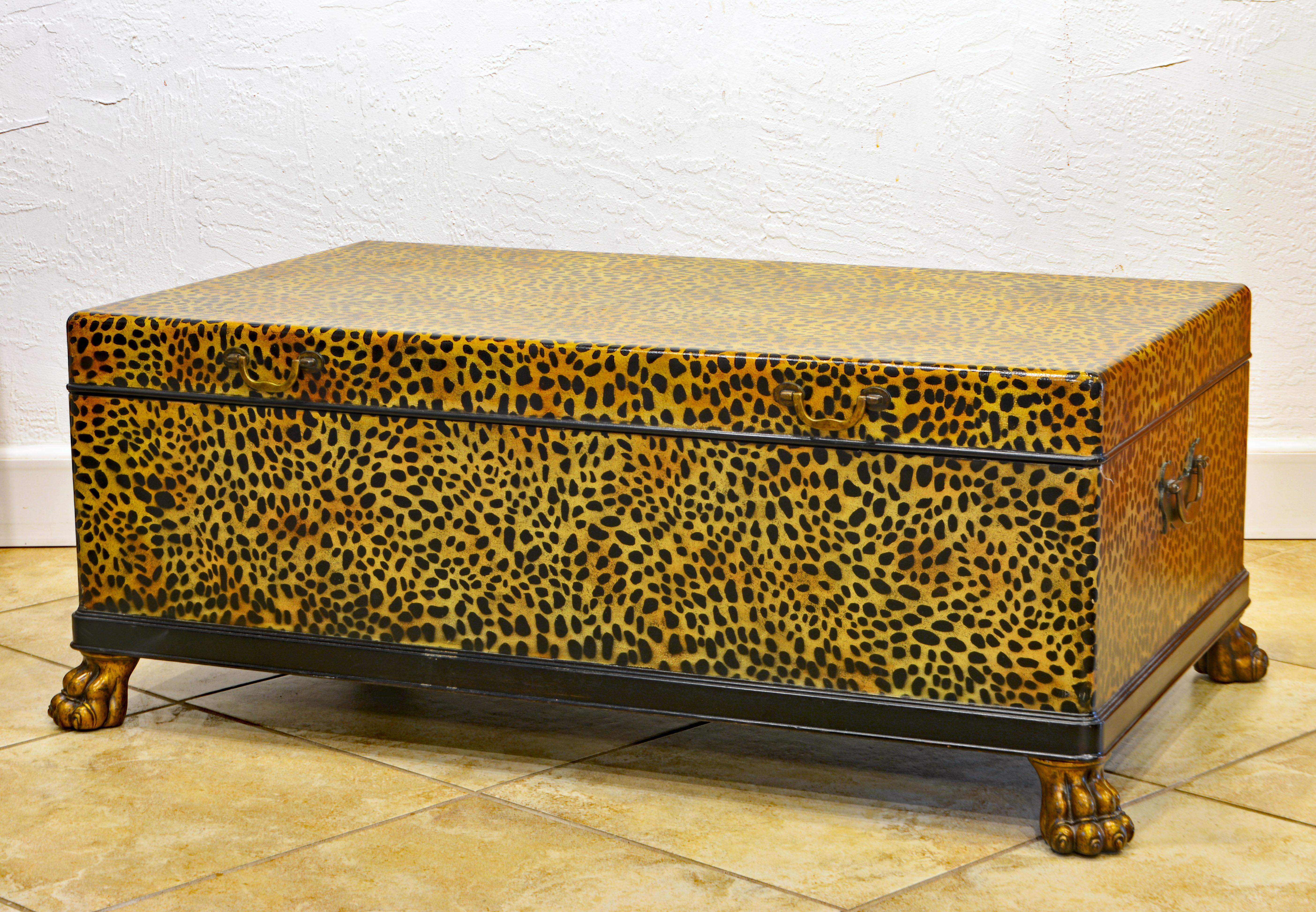 This exotic 'Panthera' cocktail table by Henry Link for Lexington is made of wood and covered with hand painted leopard style animal skin and lacquer. The lid opens up to a ventilated black painted interior. The four well modeled paw feet and the