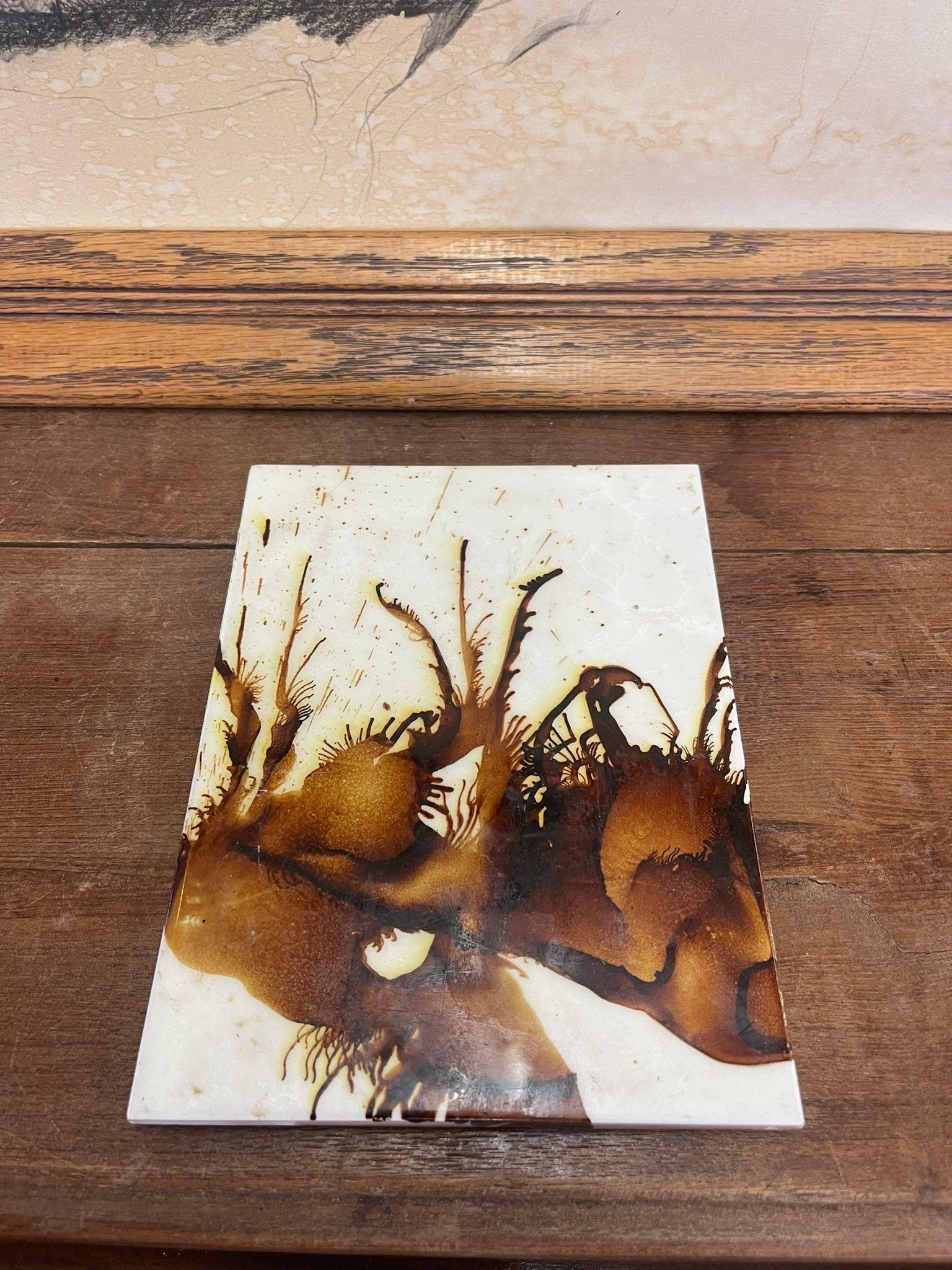 This tile is white and brown toned paint or glaze on top of a ceramic tile. Wall hook in the back for hanging. Vintage Condition Consistent with Age as Pictured.

Dimensions. 8 W ; 6 D ; 0.50 H