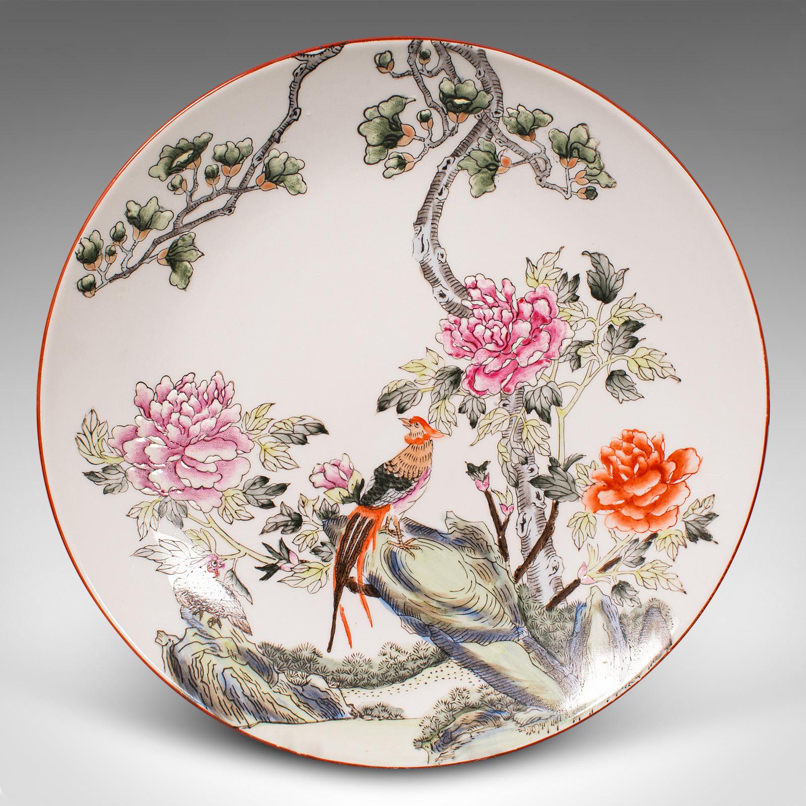 This is a vintage decorative bird plate. A Chinese, display dish with Golden Pheasant motif, dating to the late Art Deco period, circa 1940.

Striking example of Chinese taste, with an appealing decor
Displays a desirable aged patina and in good