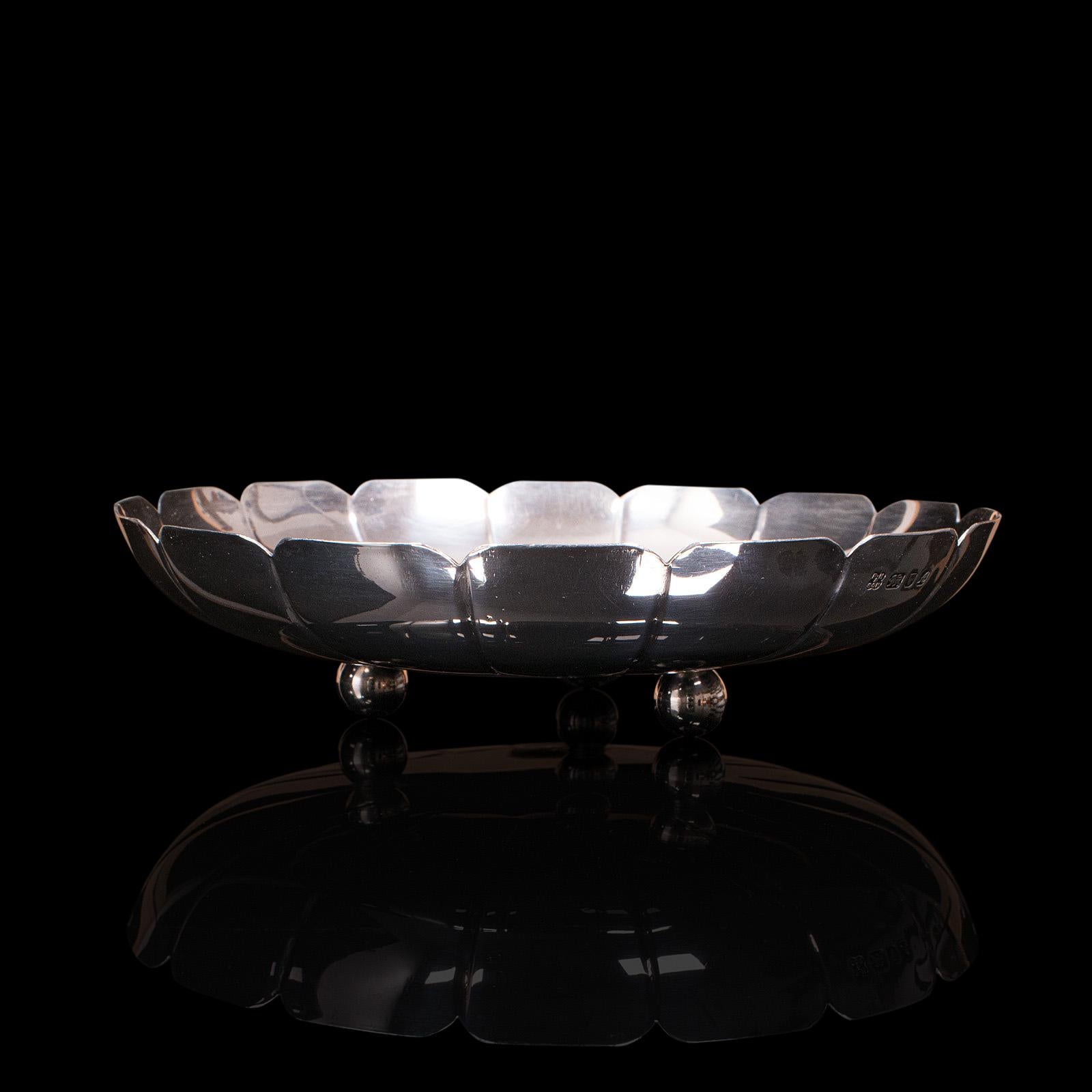 This is a vintage decorative bon bon dish. An English, sterling silver serving tray or bowl, dated by hallmark to 1975.

Attractive serving dish ideal for an afternoon tea gathering
Displaying a desirable aged patina throughout
Distinctive petal