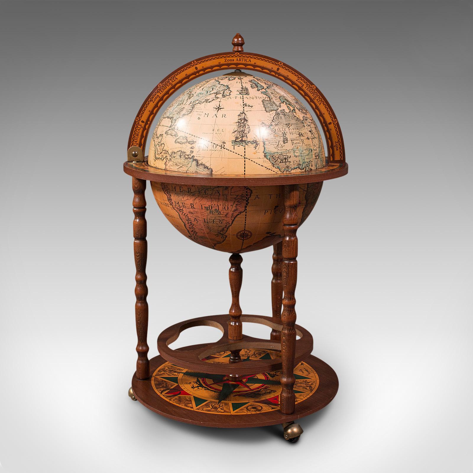 This is a vintage decorative cocktail globe. A Continental, composite hardwood drinks trolley cabinet, dating to the late 20th century, circa 1970.

Classic taste to this charming vintage globe
Displays a desirable aged patina and in good