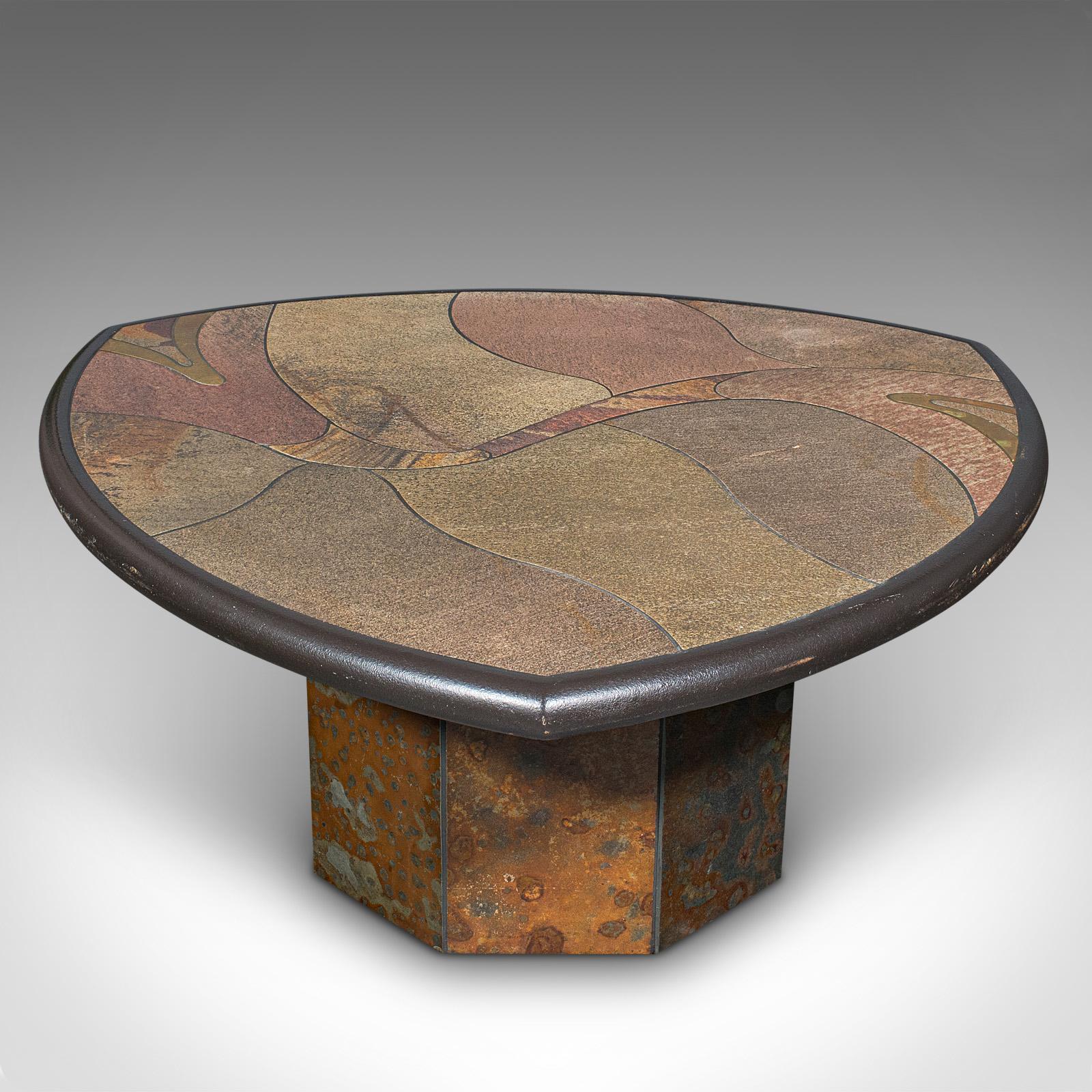 This is a heavy vintage decorative coffee table. A Dutch, slate and brass inlay Brutalist low table by Paul Kingma, dating to the late 20th century, circa 1980.

Paul Kingma (1931 - 2013) was a Dutch sculptor and later mosaic specialist, well known