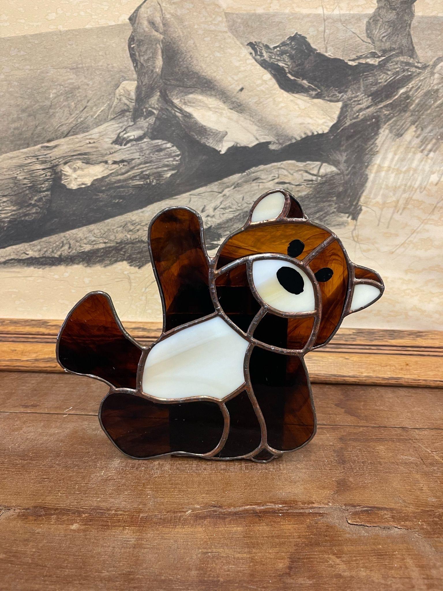 Unique Stained Glass Decor, this Teddy Bear has a Stained glass Cup attached to the Back. Could be Used as a Plant Holder or for Styling Purposes.

Dimensions. 5 W ; 6 D ; 7 H