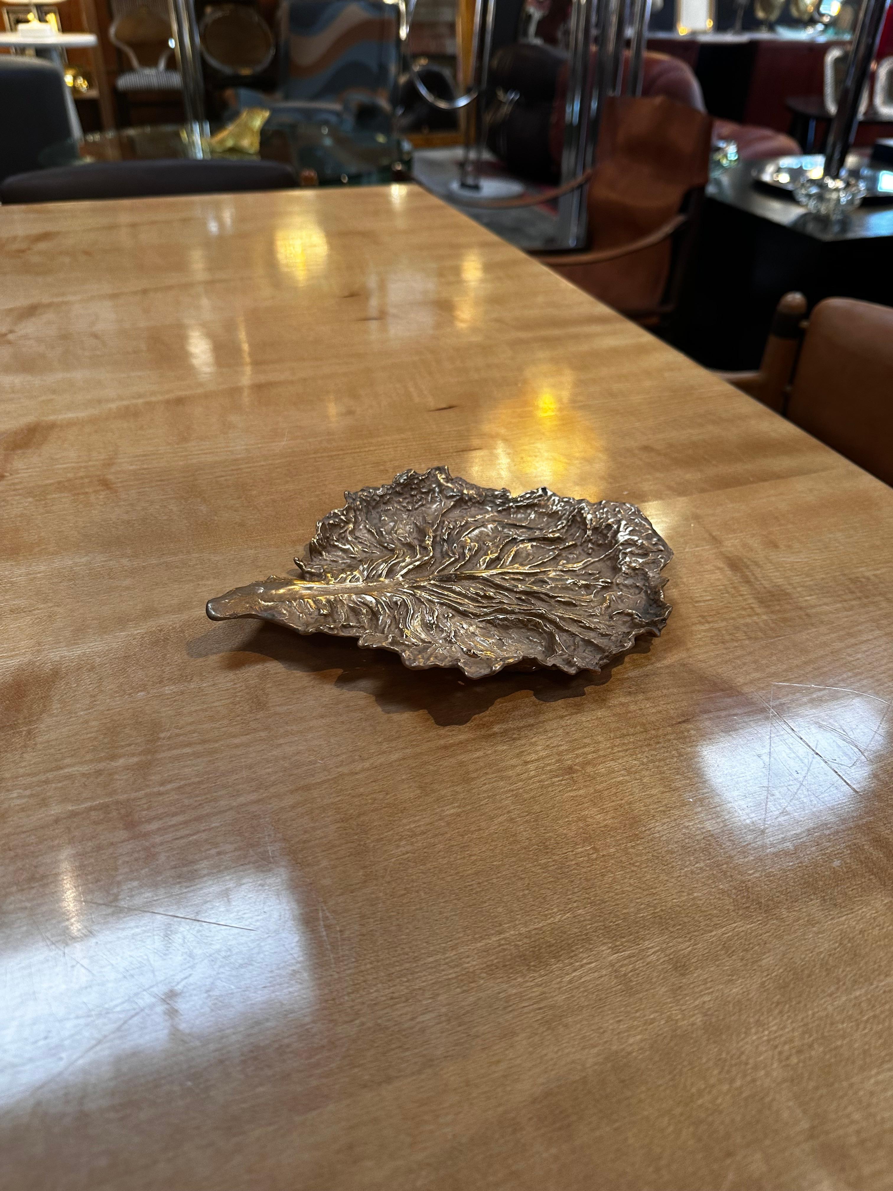 The Vintage Decorative Italian Brass Casting Leaf from the 1960s is an exquisite and nature-inspired decorative piece. Crafted in Italy during the mid-20th century, this brass casting leaf showcases intricate detailing and a timeless design. Its