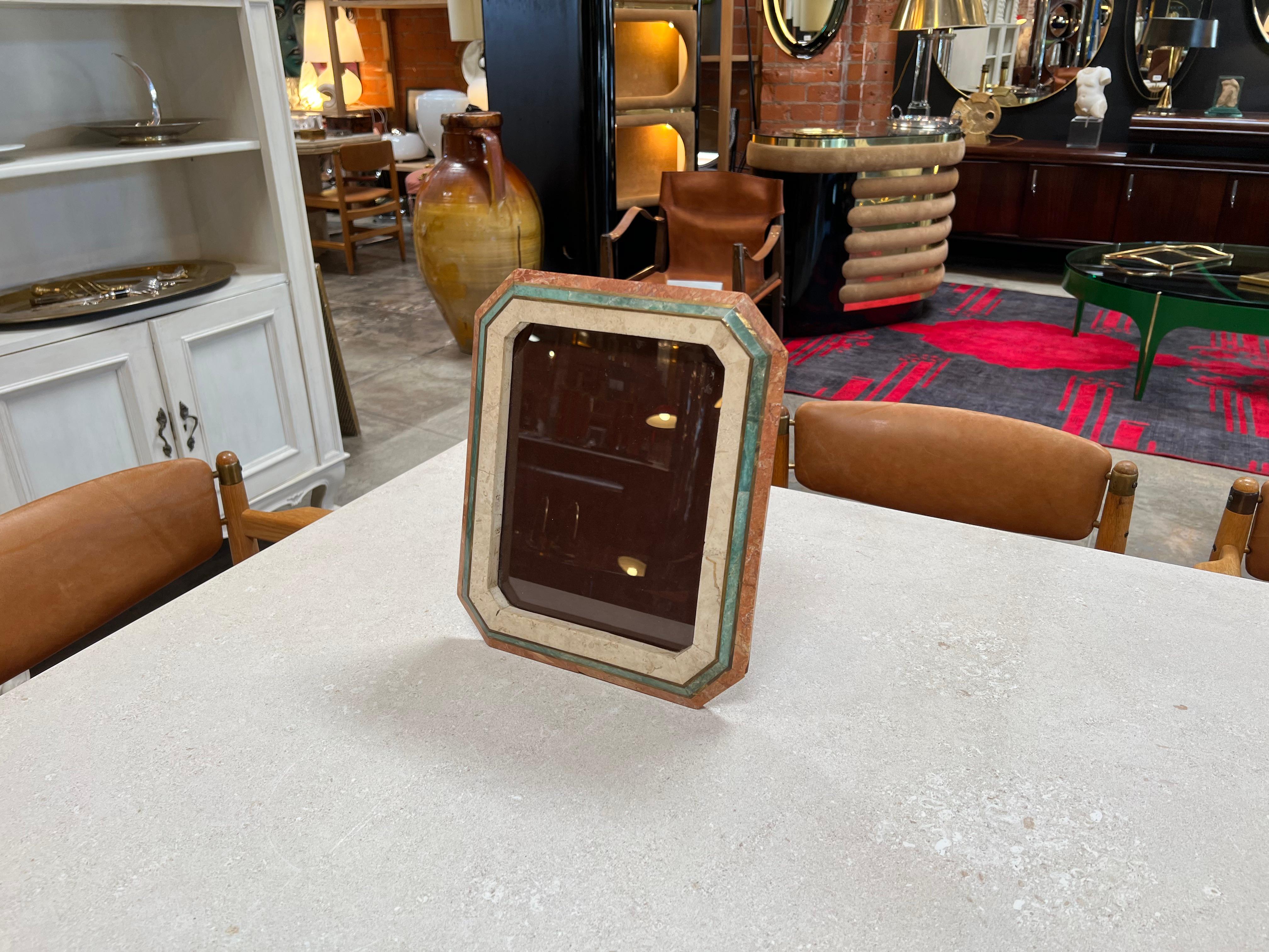 The Vintage Decorative Italian Picture Frame from the 1980s is a charming and ornate piece that captures the essence of Italian design. With intricate detailing and craftsmanship, this frame showcases a touch of vintage elegance, making it a perfect