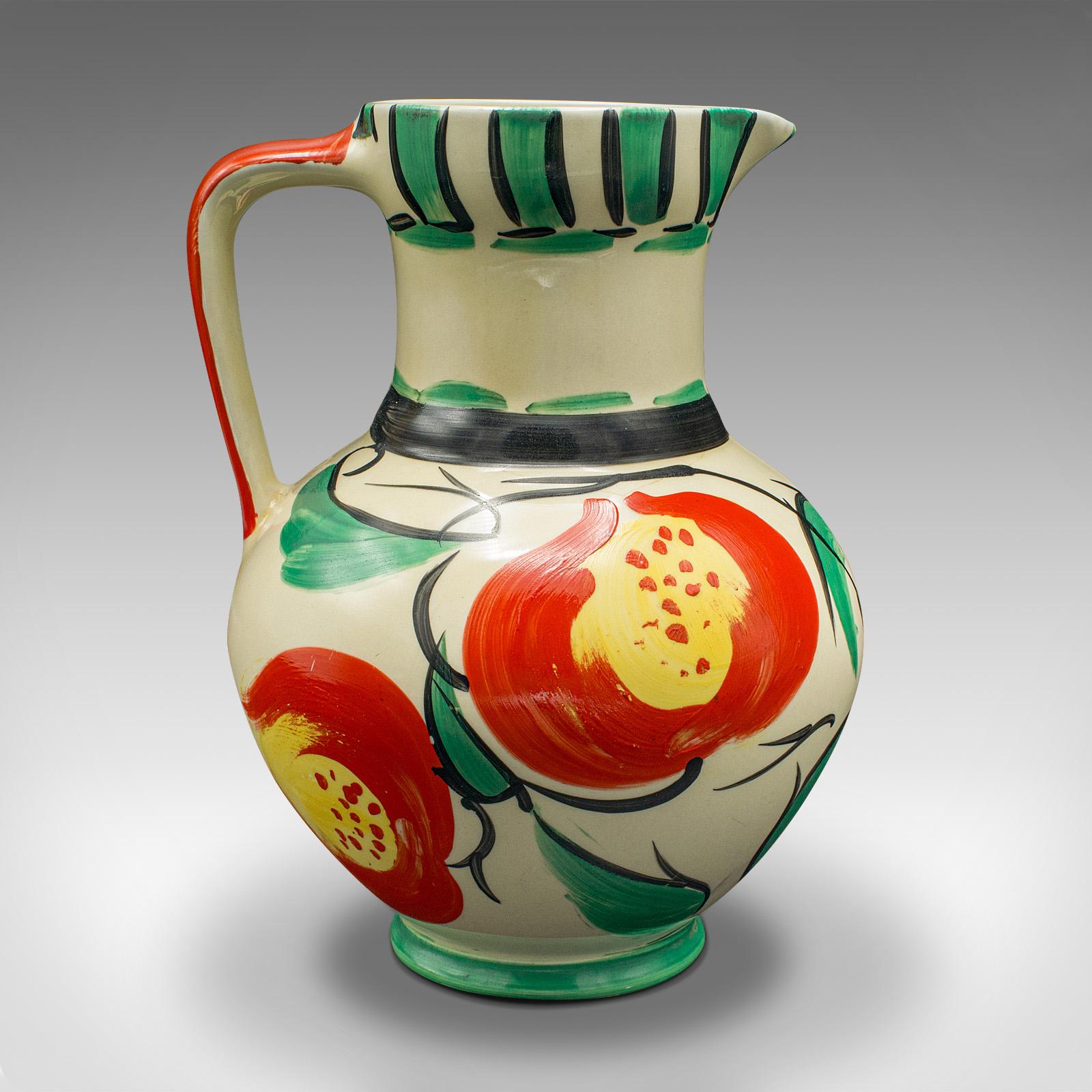 This is a vintage decorative jug. An English, ceramic creamer or pourer, dating to the early 20th century, circa 1930.

Temptingly cheerful colour to this sweet ceramic jug
Displays a desirable aged patina and in good order
Light yellow ceramic