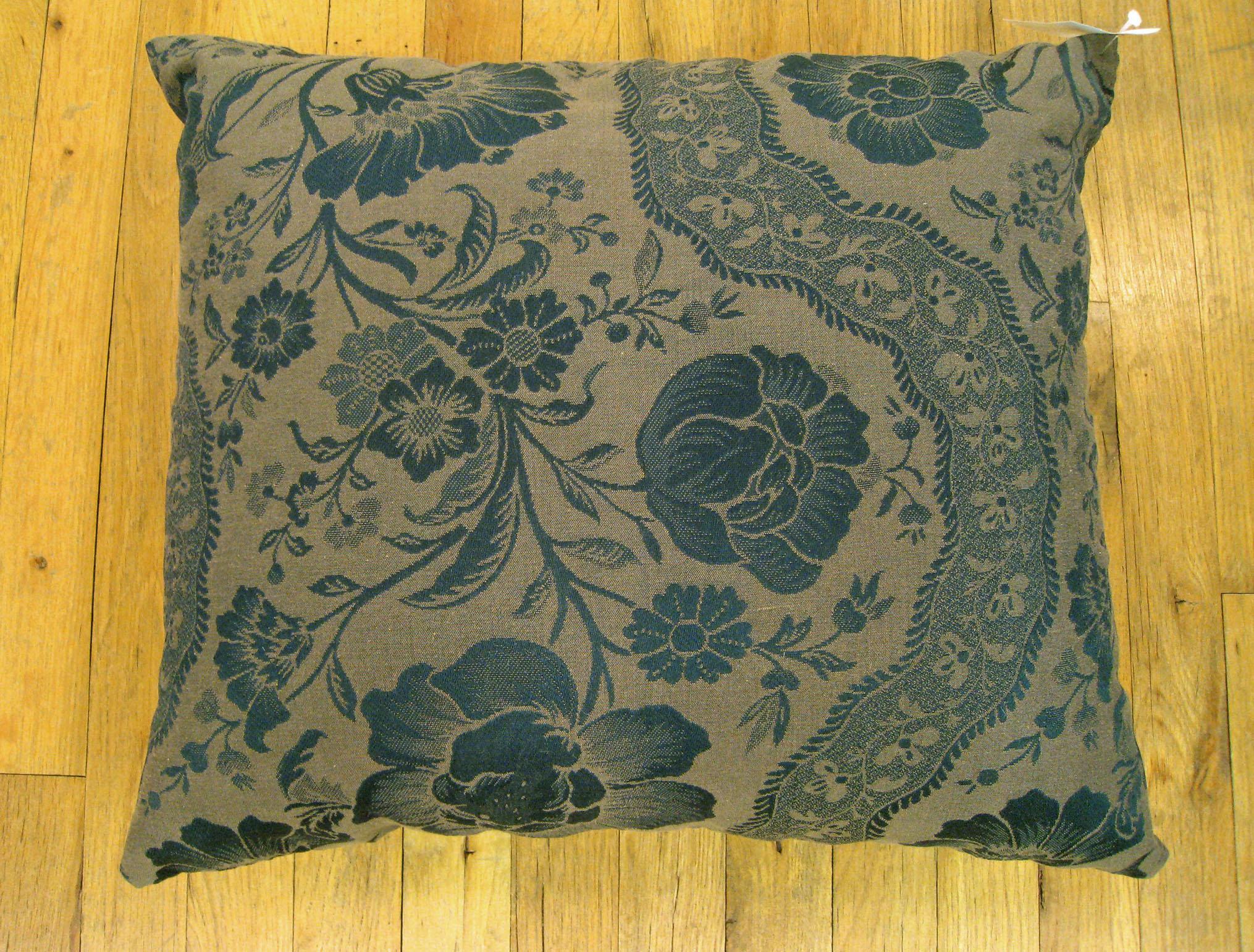 A vintage decorative pillow with a directional floral pattern, size: 22
