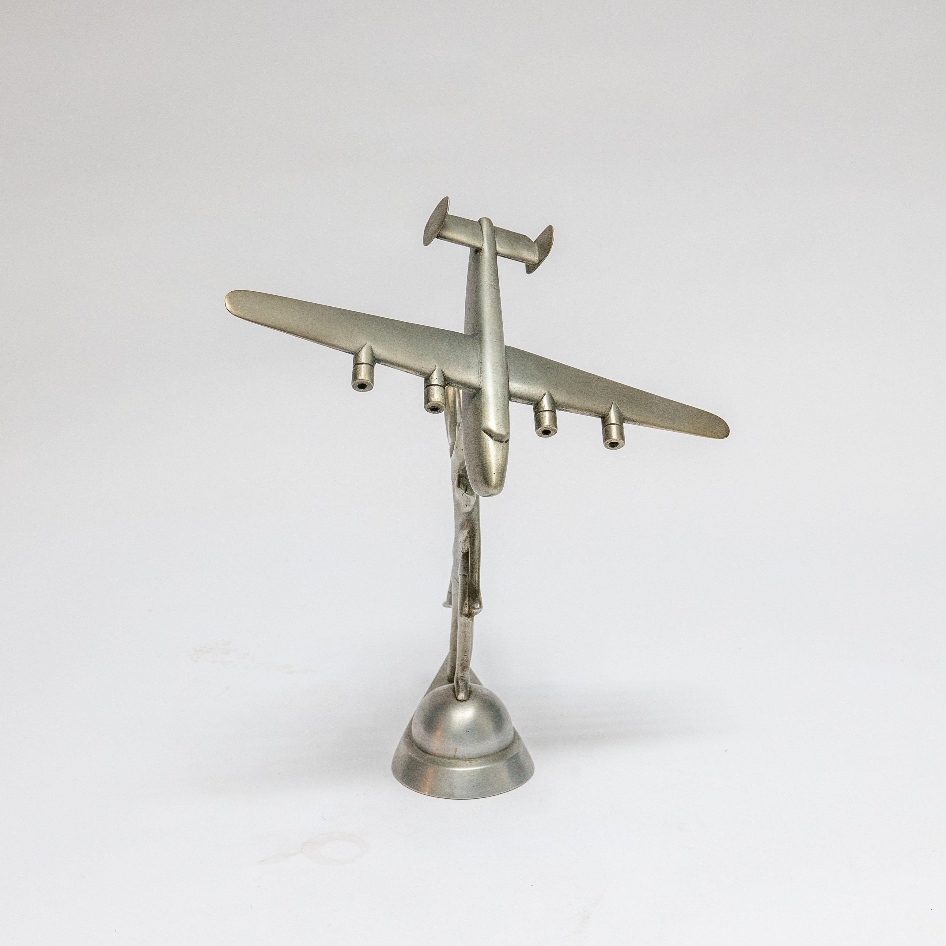 Mid-20th Century Decorative Sculpture of a Goddess Holding a Consolidated B-24 Liberator For Sale