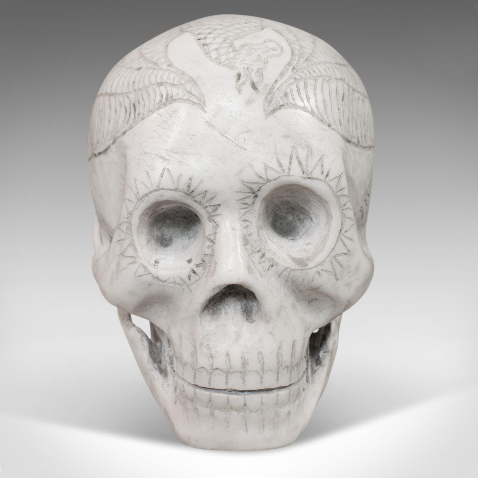 This is a vintage decorative skull ornament. An English marble showpiece with a hand-finished design by Dominic Hurley, dating to the late 20th century.

Classic fantasy iconography in a one-off design
Displays a desirable aged patina
Of