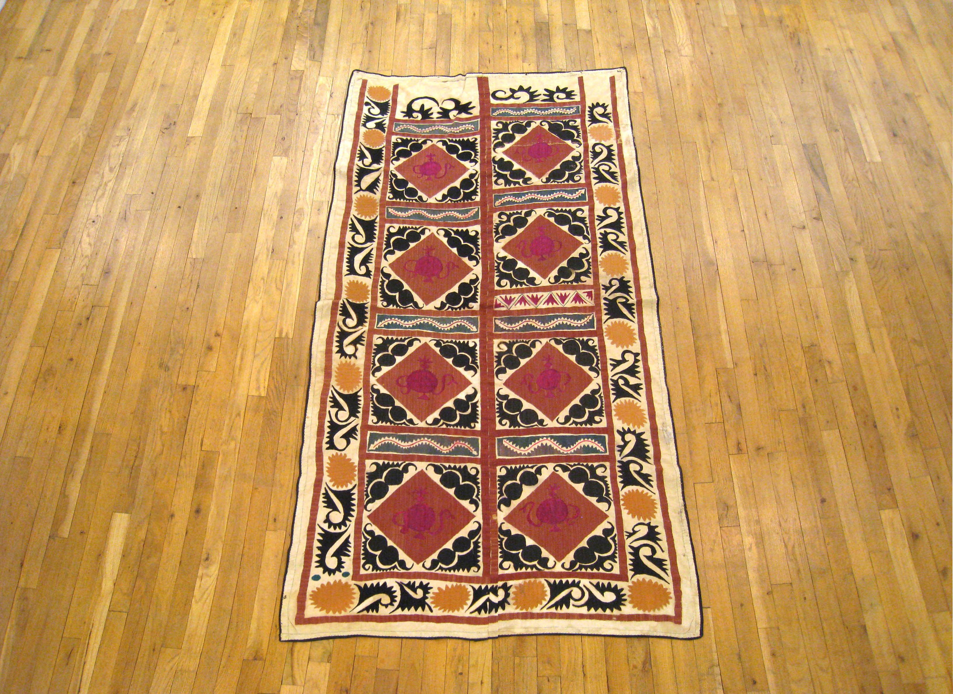 A vintage decorative Suzani textile, circa 1920, size 6'9