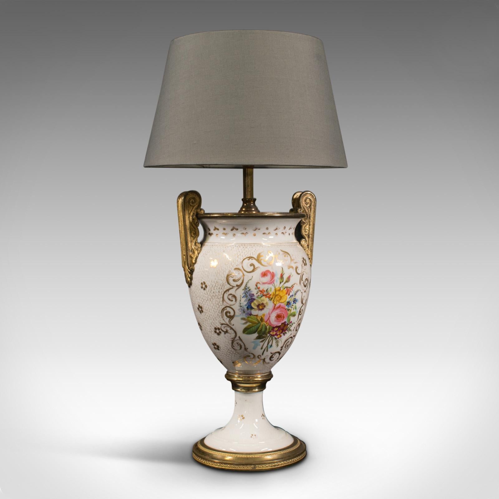 This is a vintage decorative table lamp. A French, ceramic urn-shaped ornamental light, dating to the late 20th century, circa 1970.

Pleasingly decorative lamp, with classic foliate motif
Displays a desirable aged patina and in good