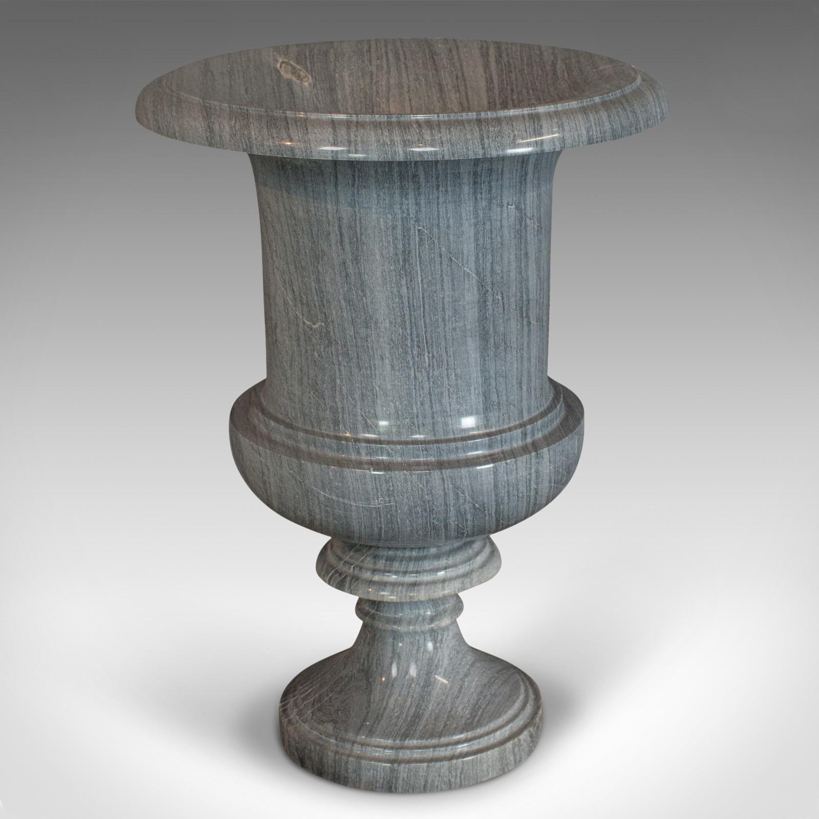 This is a vintage decorative vase. An English, platinum striata marble baluster urn, dating to the late 20th century.

Stunning marble vase, to enhance any space
Displays a desirable aged patina
Classic baluster urn form with an abundance of