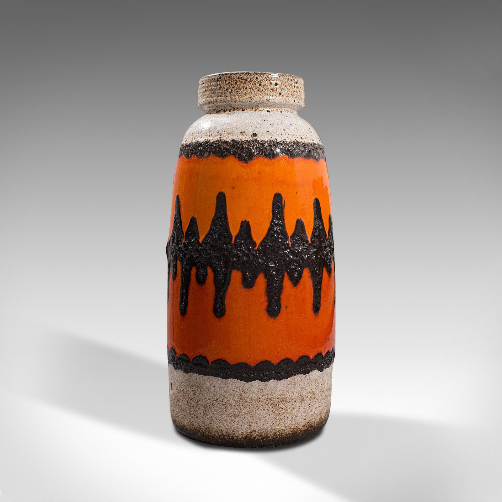 This is a colorful vintage decorative vase. A German, ceramic lava pattern flower vase or hallway stick stand, dating to the mid 20th century, circa 1960.

A bold, vibrant flower vase with tapering form
Displaying a desirable aged patina and in